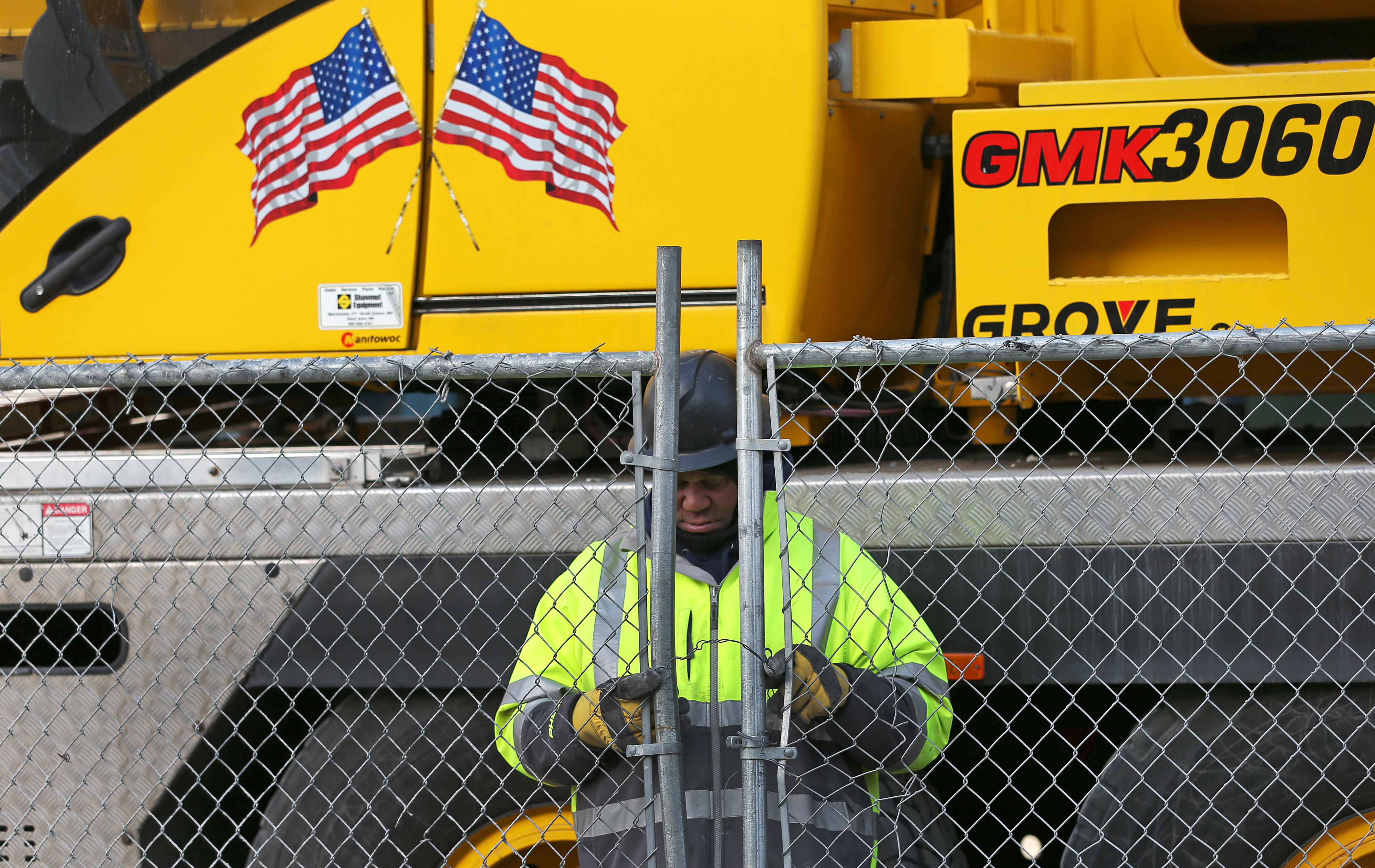 Construction workers at the Omni Hotels & Resorts in the Seaport in Boston call it a day, as the mayor ordered a halt to construction projects today.