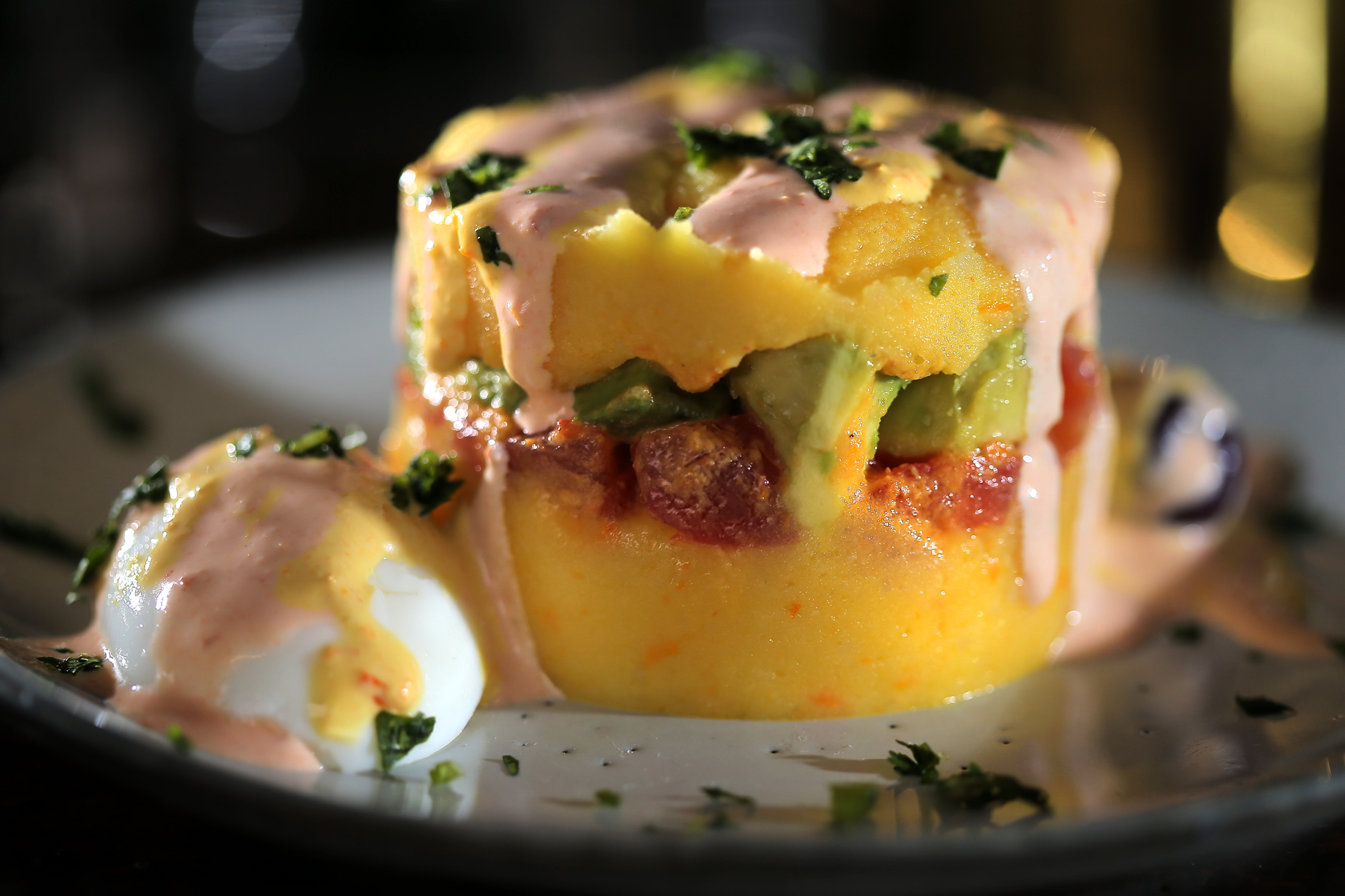 Chef of the year JuanMa Calderón’s spicy potato terrine — causa de avocado and tomato — at Celeste.