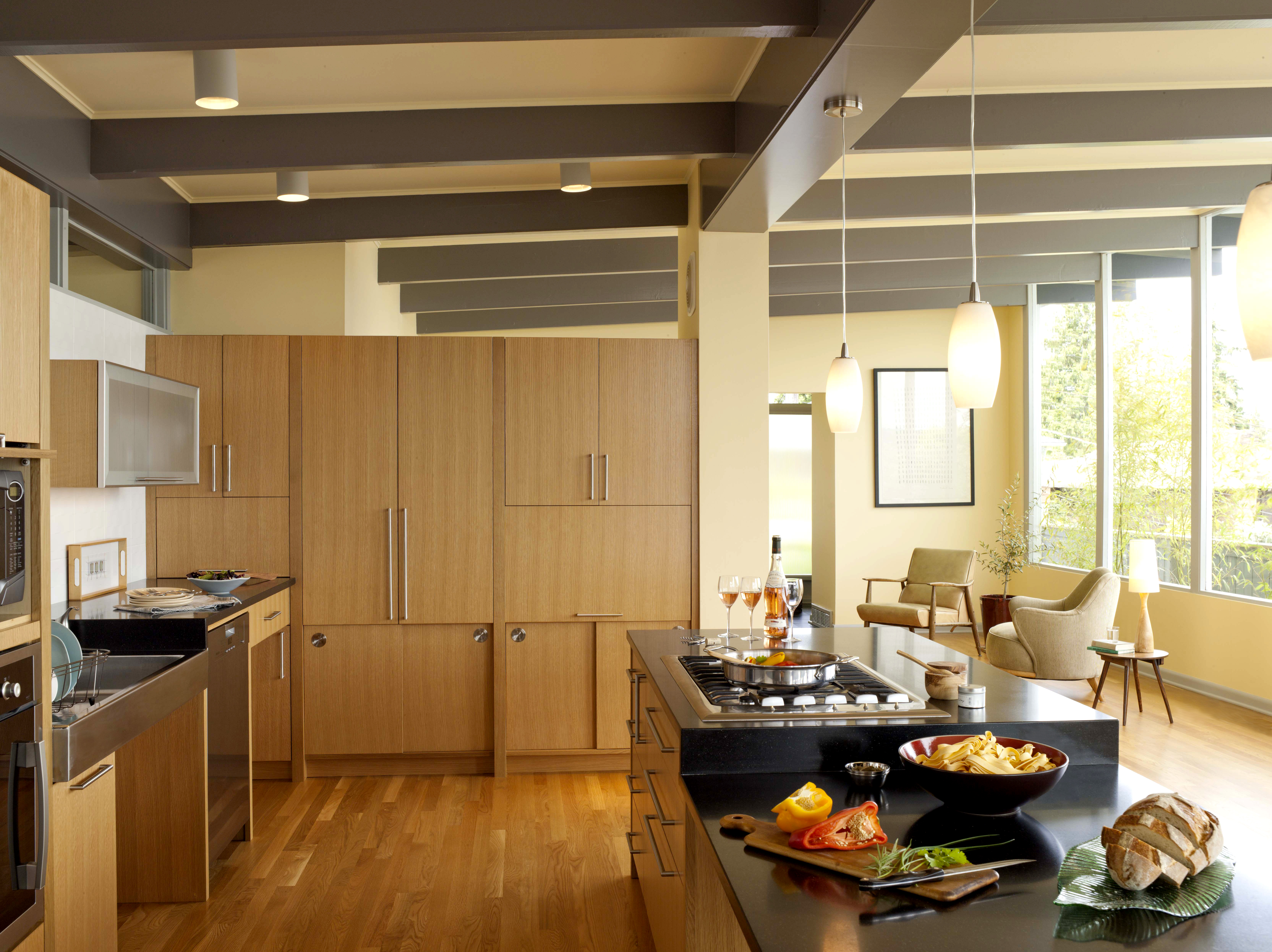 By placing counters at different heights, the kitchen accommodates tall and short cooks, seated or standing. “The Accessible Home” (The Taunton Press)