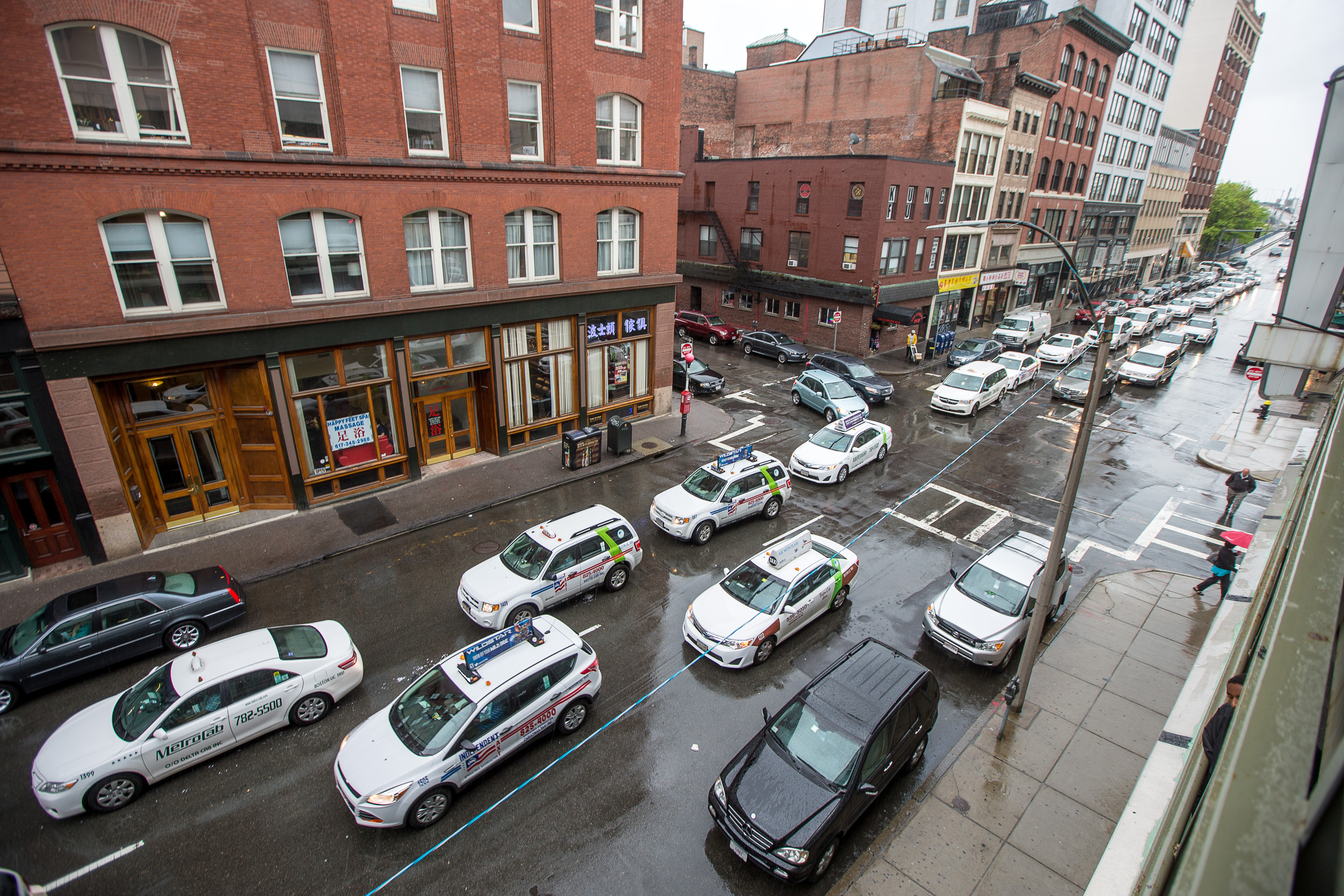 Taxi lobbyists vowed to fight Baker’s proposal in the Legislature. Pictured: Hundreds of taxi drivers paraded down Lincoln Street while honking their horns in protest near Uber headquarters last year.