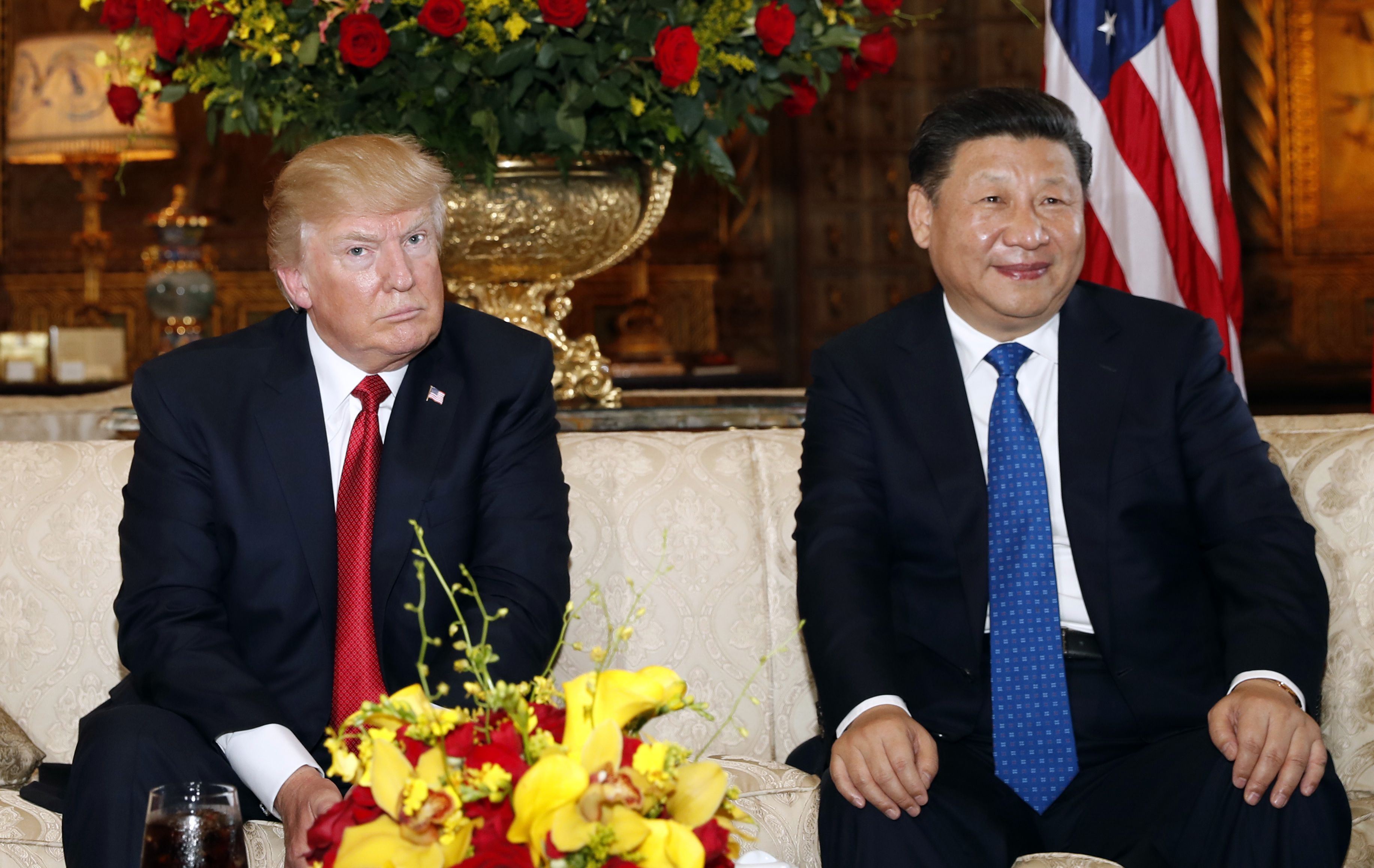 President Donald Trump and Chinese President Xi Jinping posed for photographers before a meeting at Mar-a-Lago on Thursday.