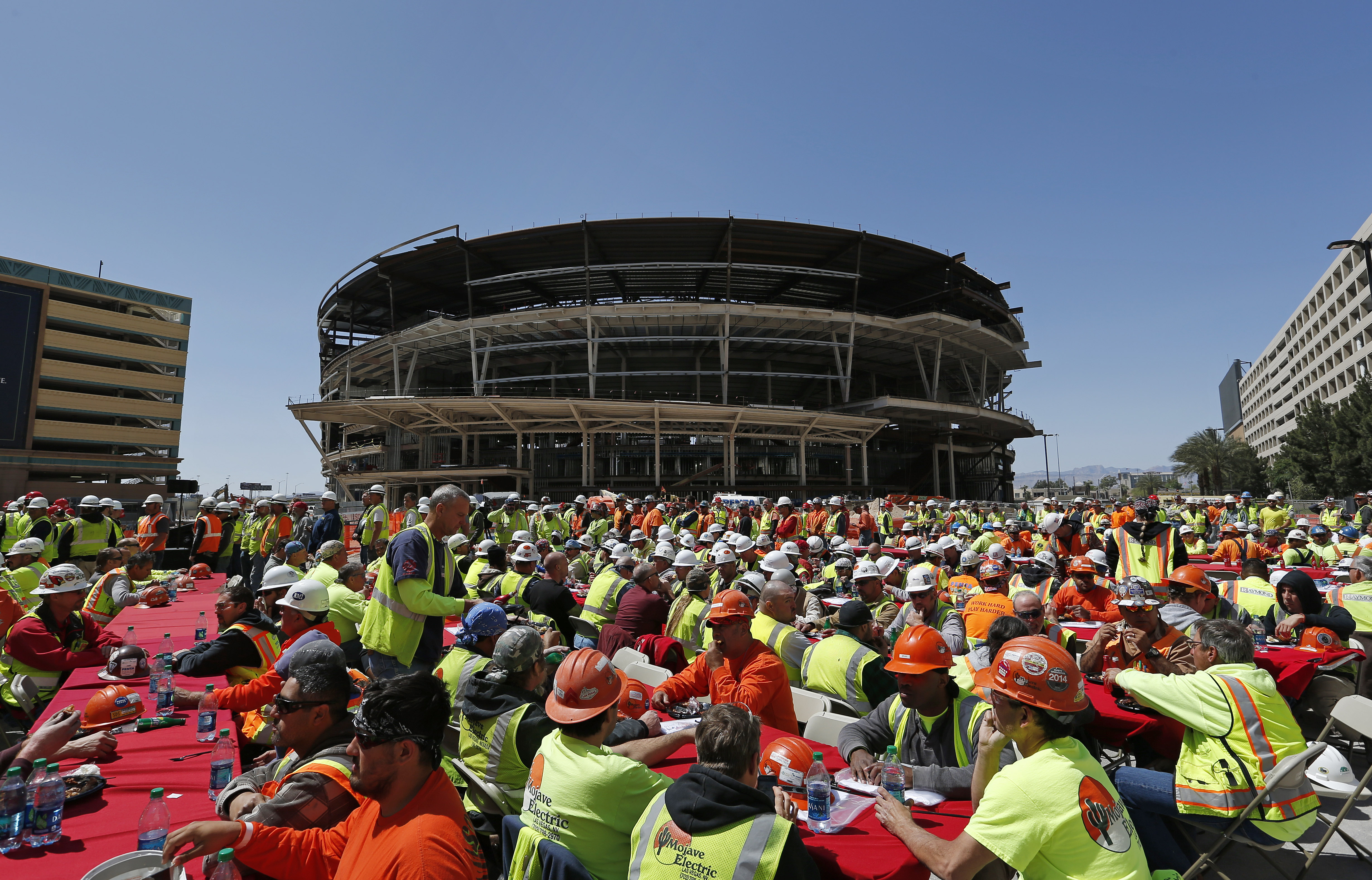 Construction workers ate lunch in April near an MGM arena being built behind the New York-New York casino-hotel in Las Vegas.