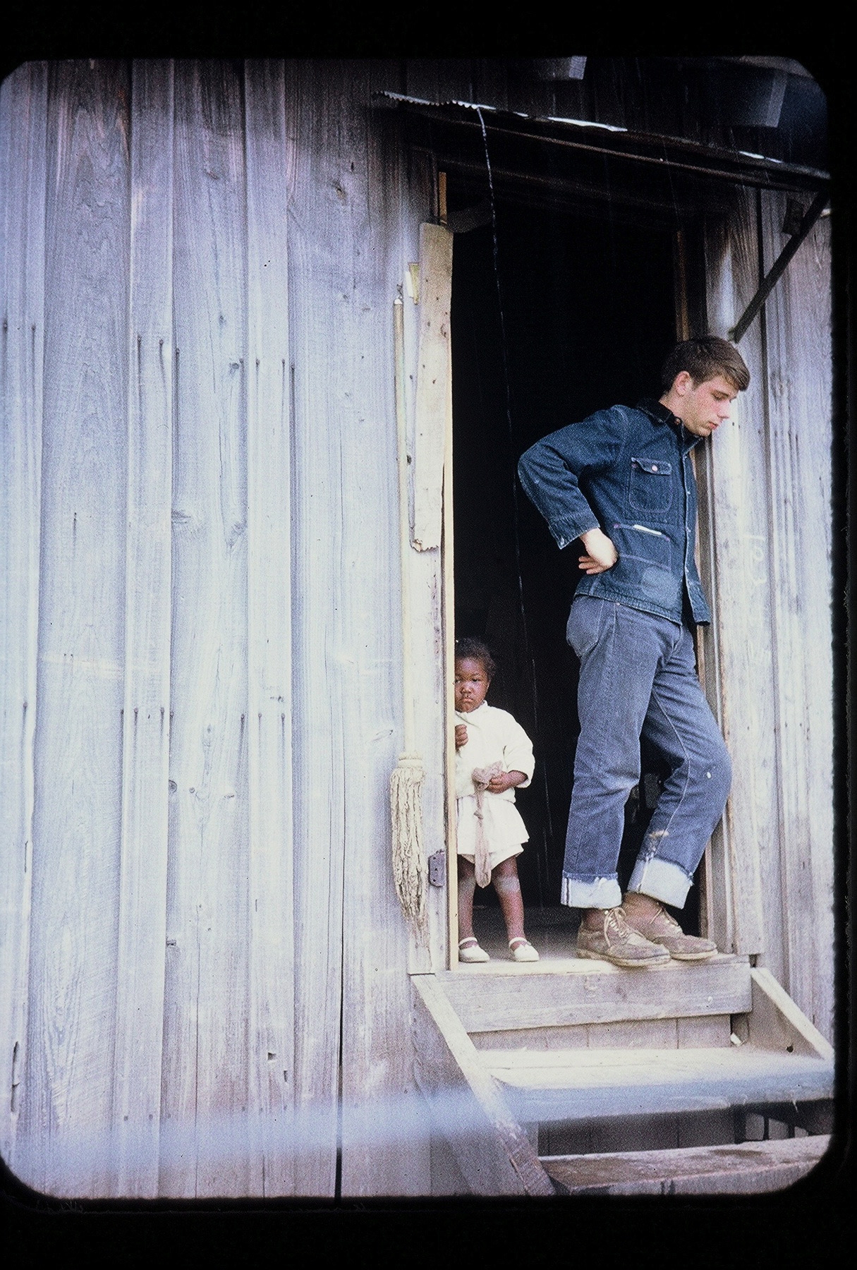 Chris Williams stood with young Martha Nelson at their house on the Hayes Plantation, where her family worked.