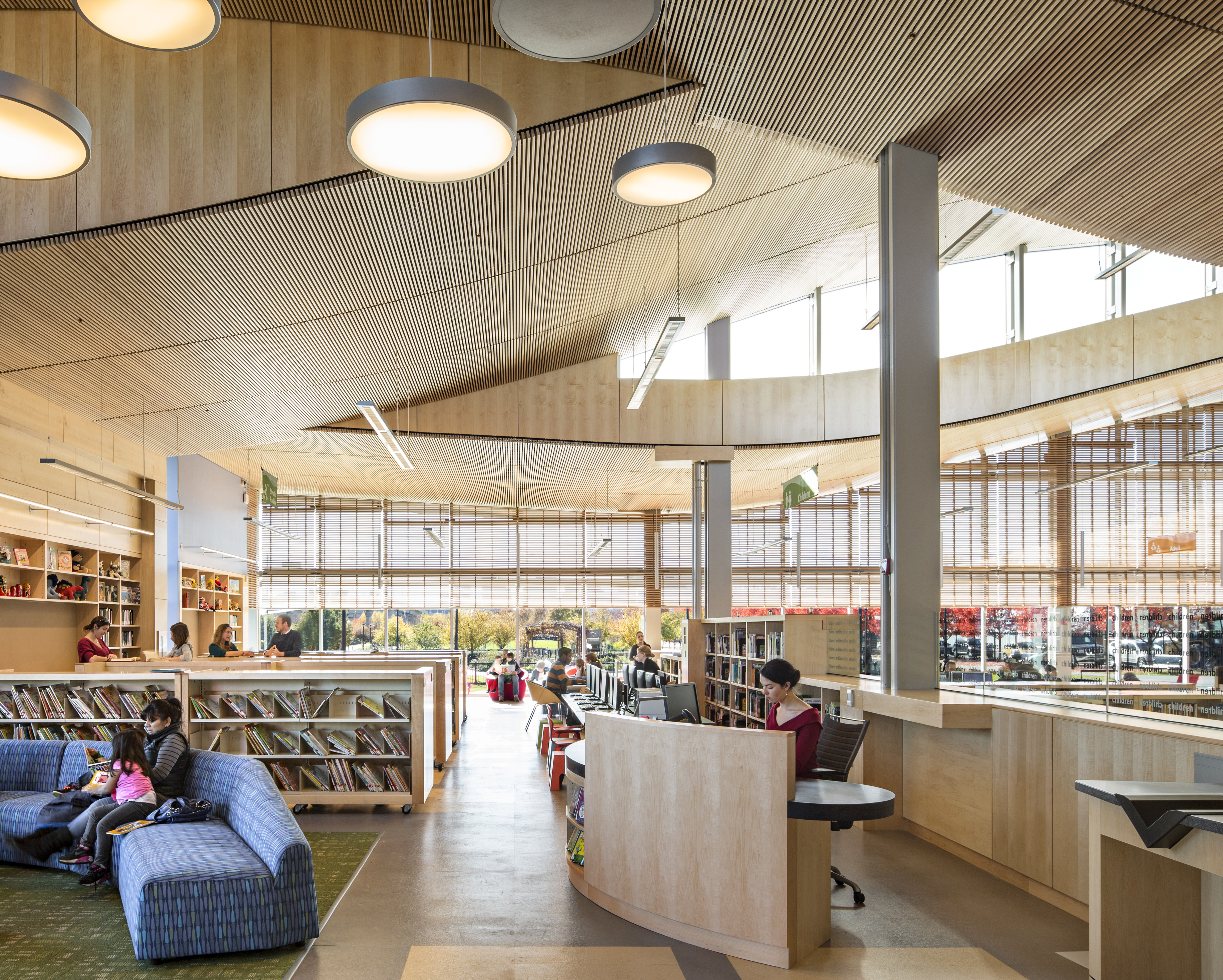 The Boston Public Library’s East Boston branch has no interior walls, giving the building a sense of community that is different from the typical library feel created by separate areas for different age groups.
