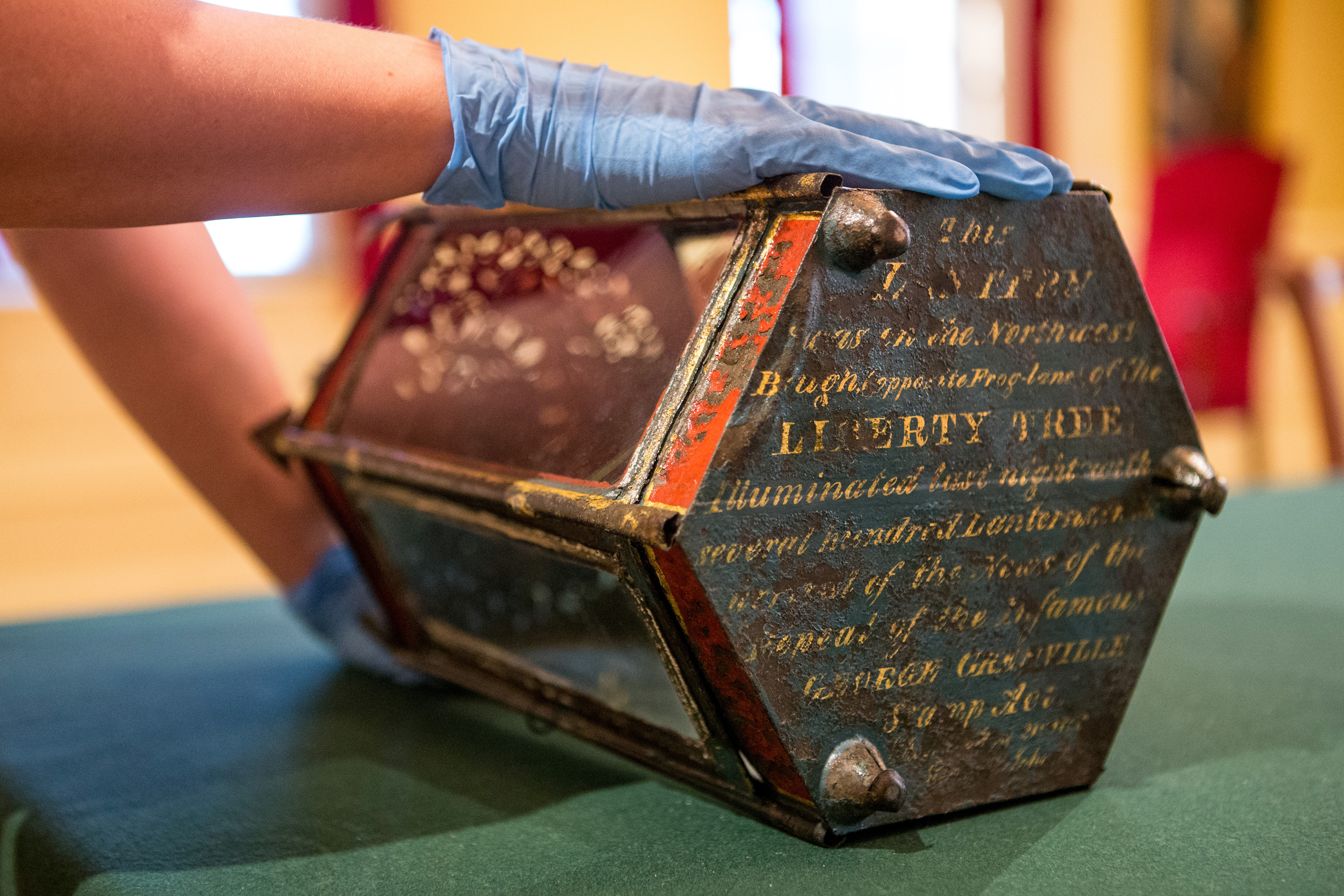 A lantern that hung from the elm in 1766 bears its history in an inscription.