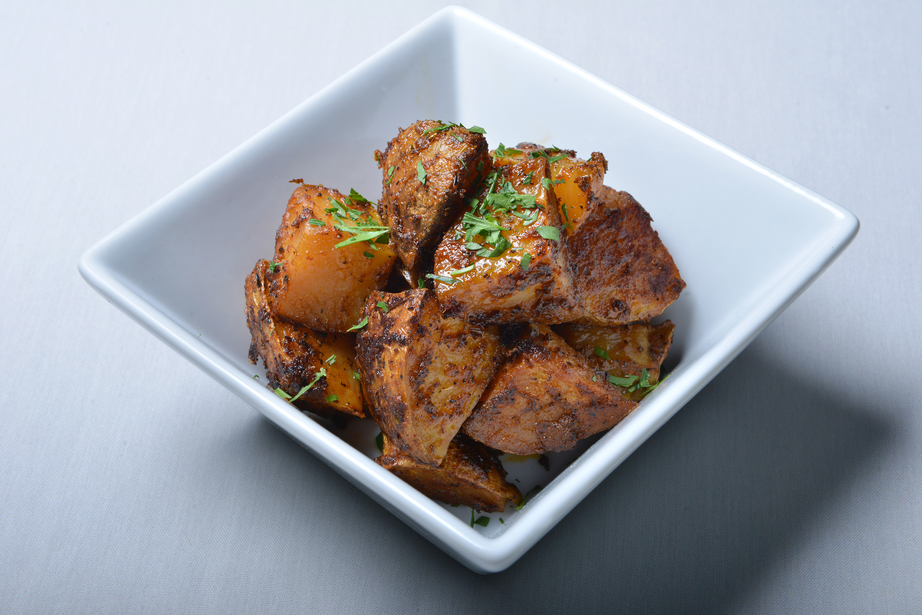 Yia Yia’s Potatoes roasted with smoked paprika and oregano.