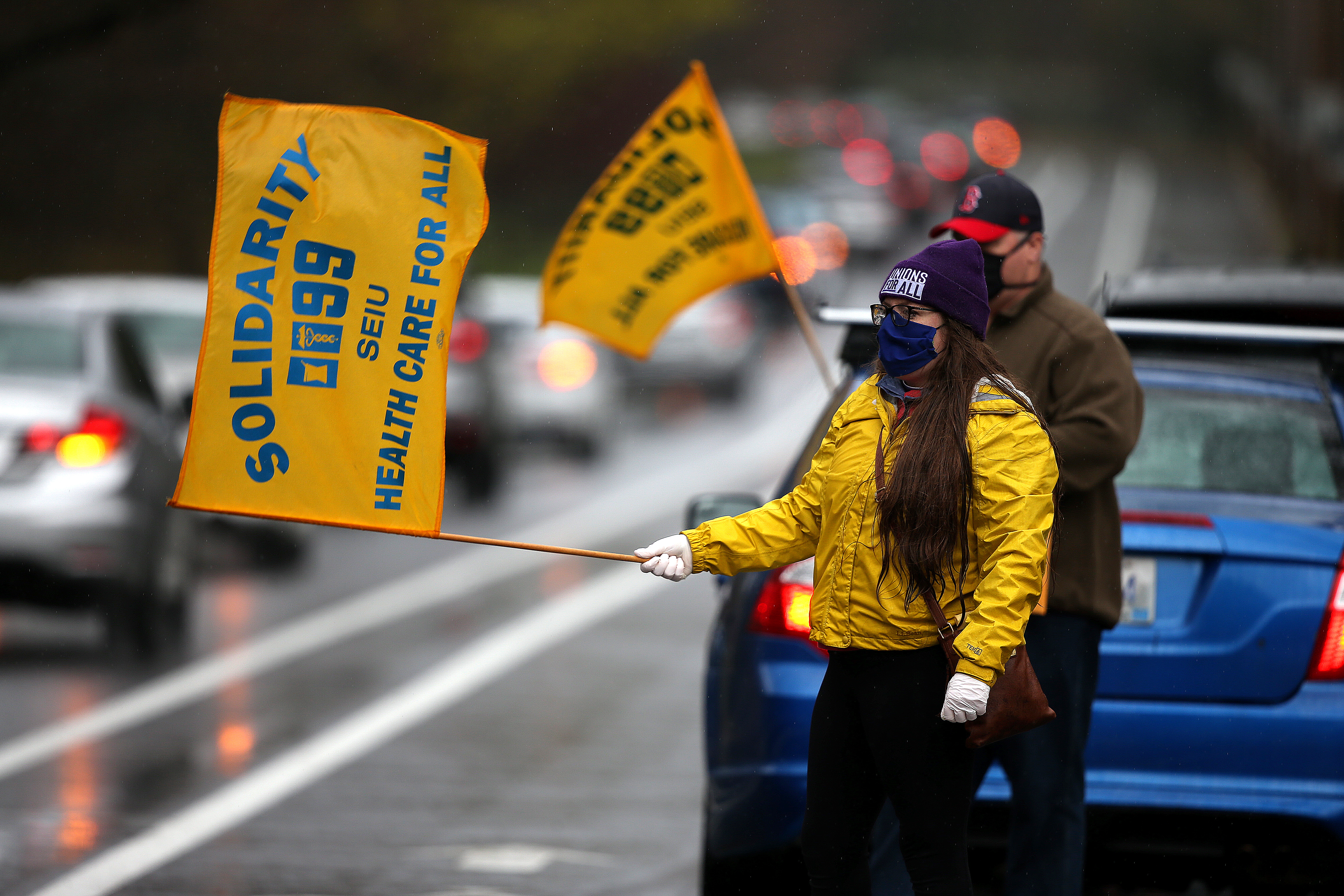 Union organizer Mary Murphy-Walsh cheered on an emergency caravan protest outside Butler Hospital in Providence to demand that management provide critical N-95 respirators to all health care professionals at the facility.