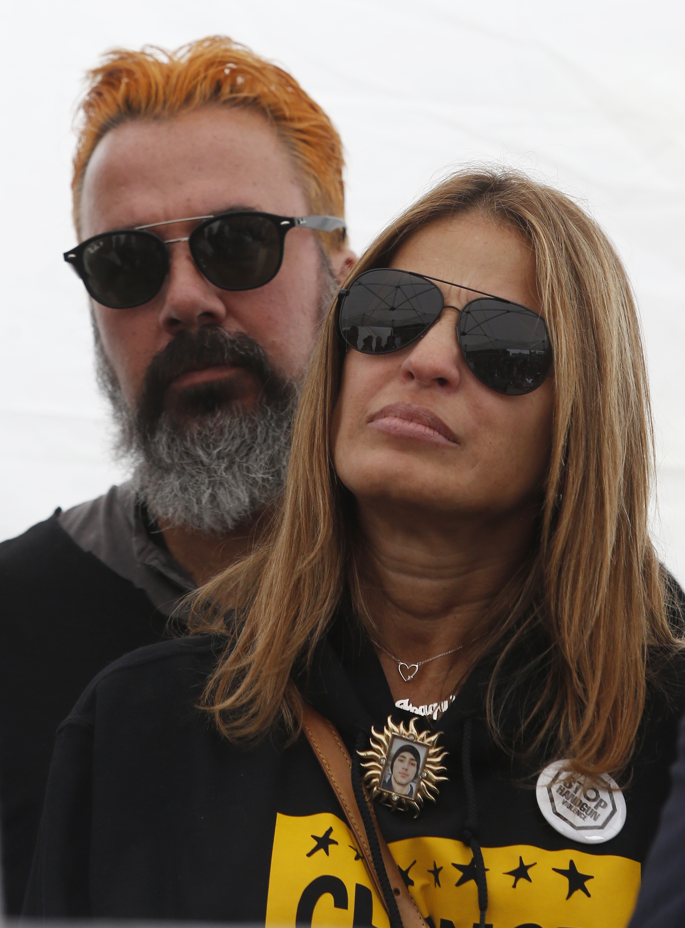Patricia and Manuel Oliver listened to a speaker during a press conference after Stop Handgun Violence and Change the Ref unveiled the new billboard. Reporter:
