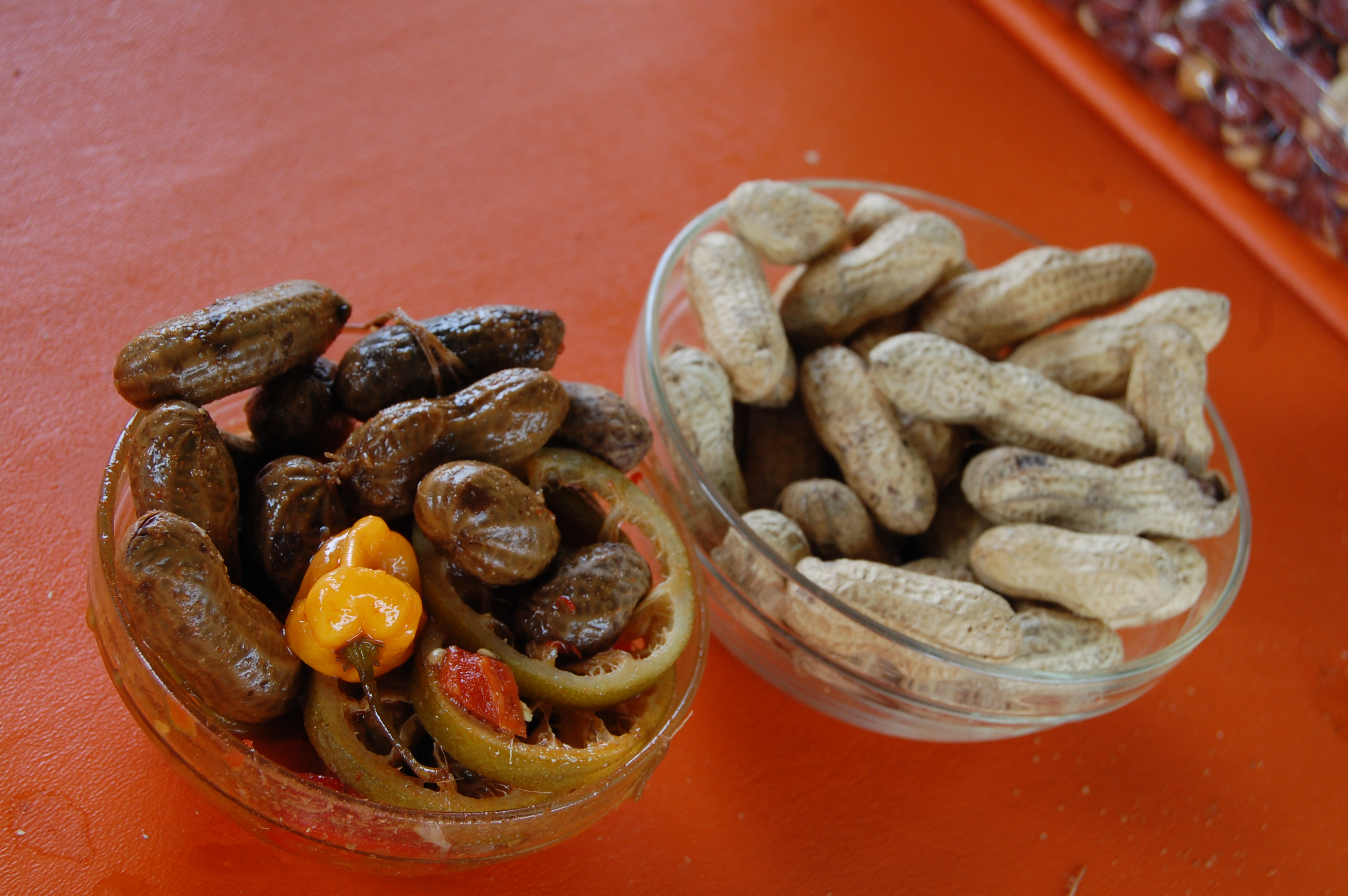 Steve’s Cajun boiled peanuts (left) and regular roasted peanuts.