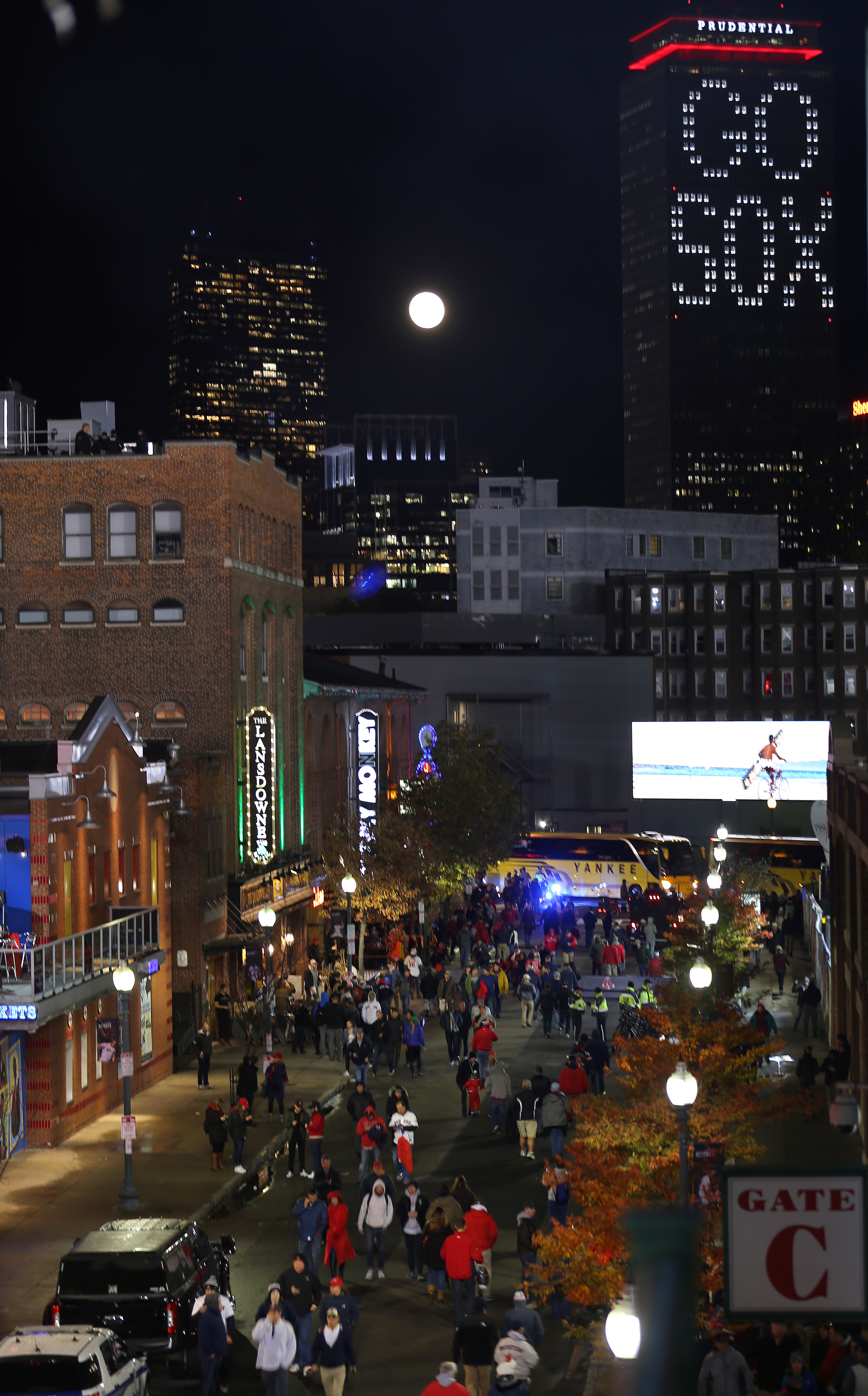 Looking down Landsdowne Street with the the full moon and Prudential building in the background.
