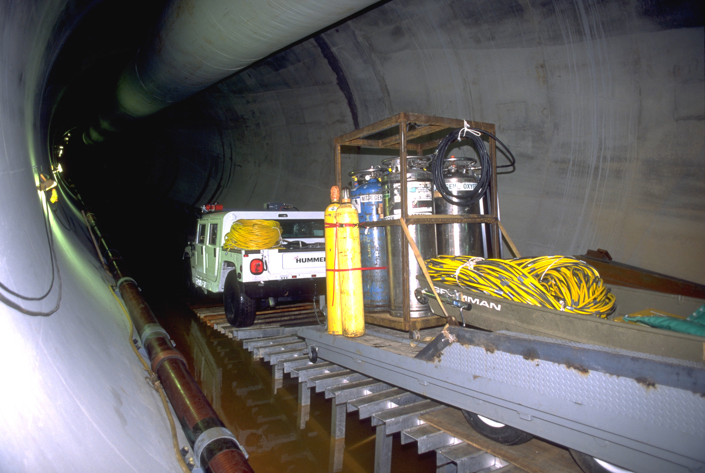 A two-way trailer attached to a pair of Humvees holds tanks of liquid oxygen and liquid nitrogen for mixing.