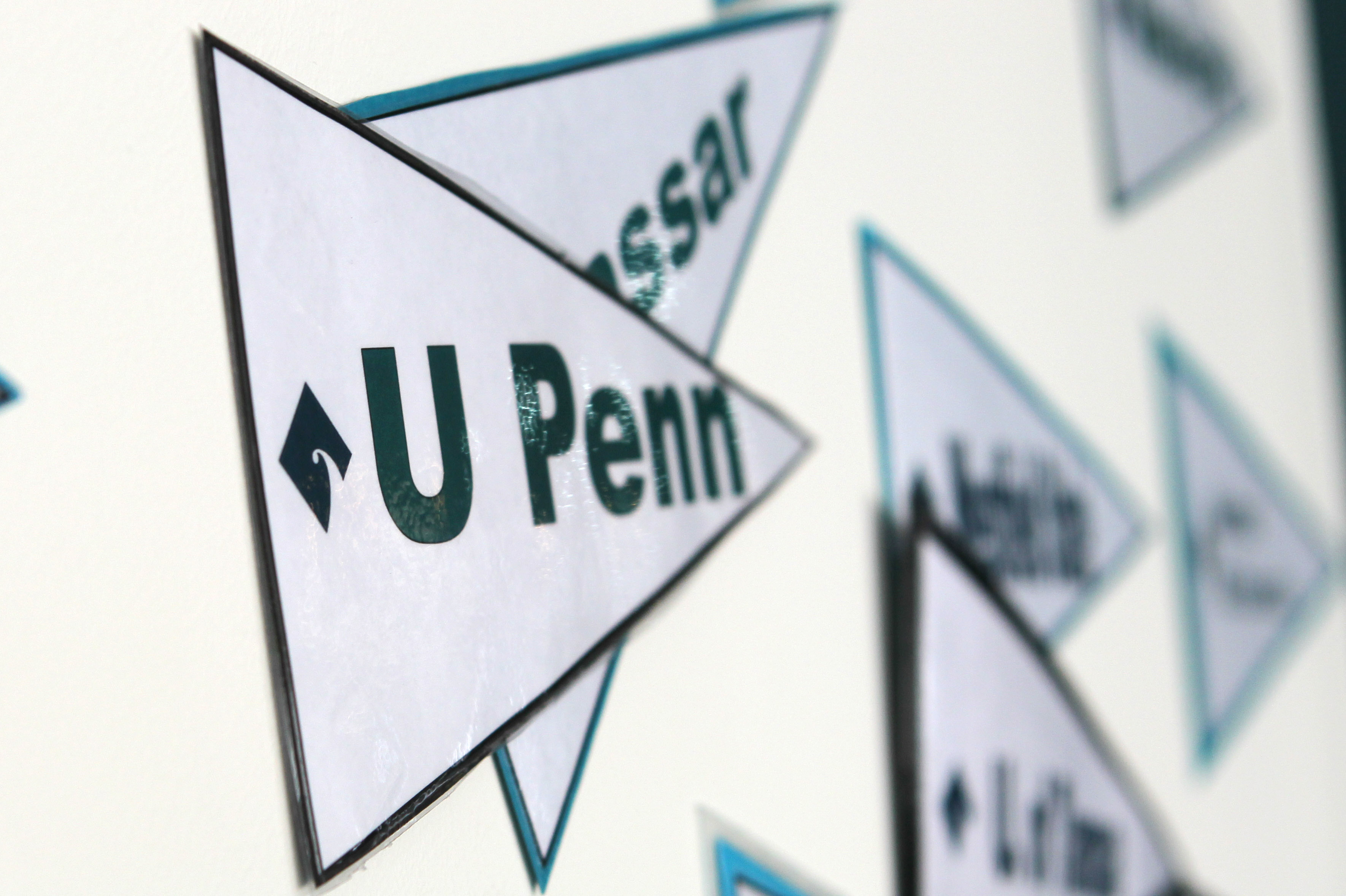 The walls are decorated with college pennants at Bottom Line HQ in Jamaica Plain.