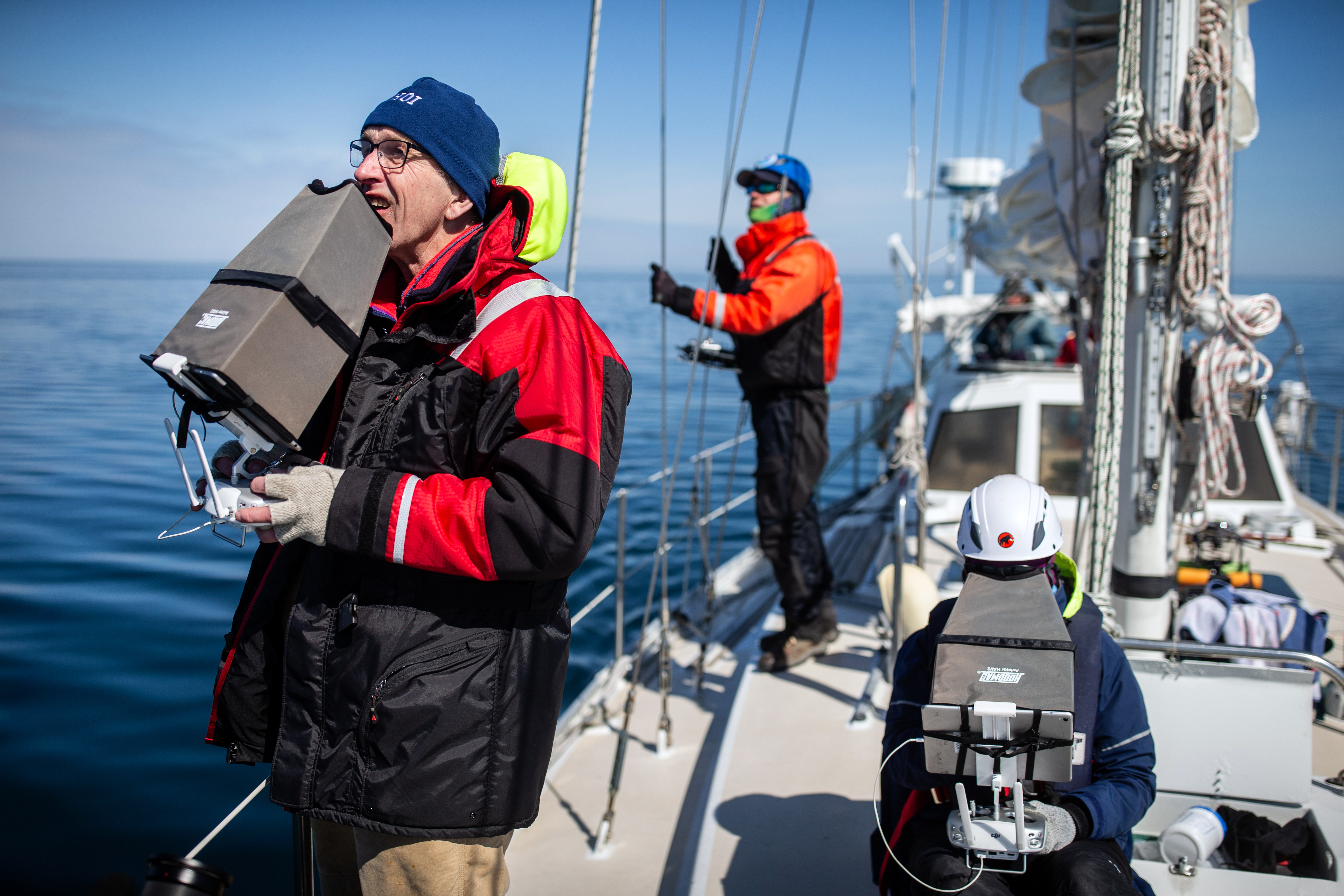 Michael Moore (left) and Carolyn Miller worked to collect whale data on Moore’s sailboat Rosita in Cape Cod Bay.
