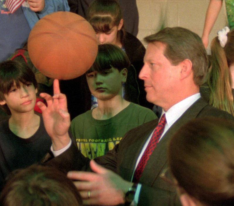Vice President Al Gore spun a basketball on his finger while visiting with students at Beech Street School in Manchester in 1998.