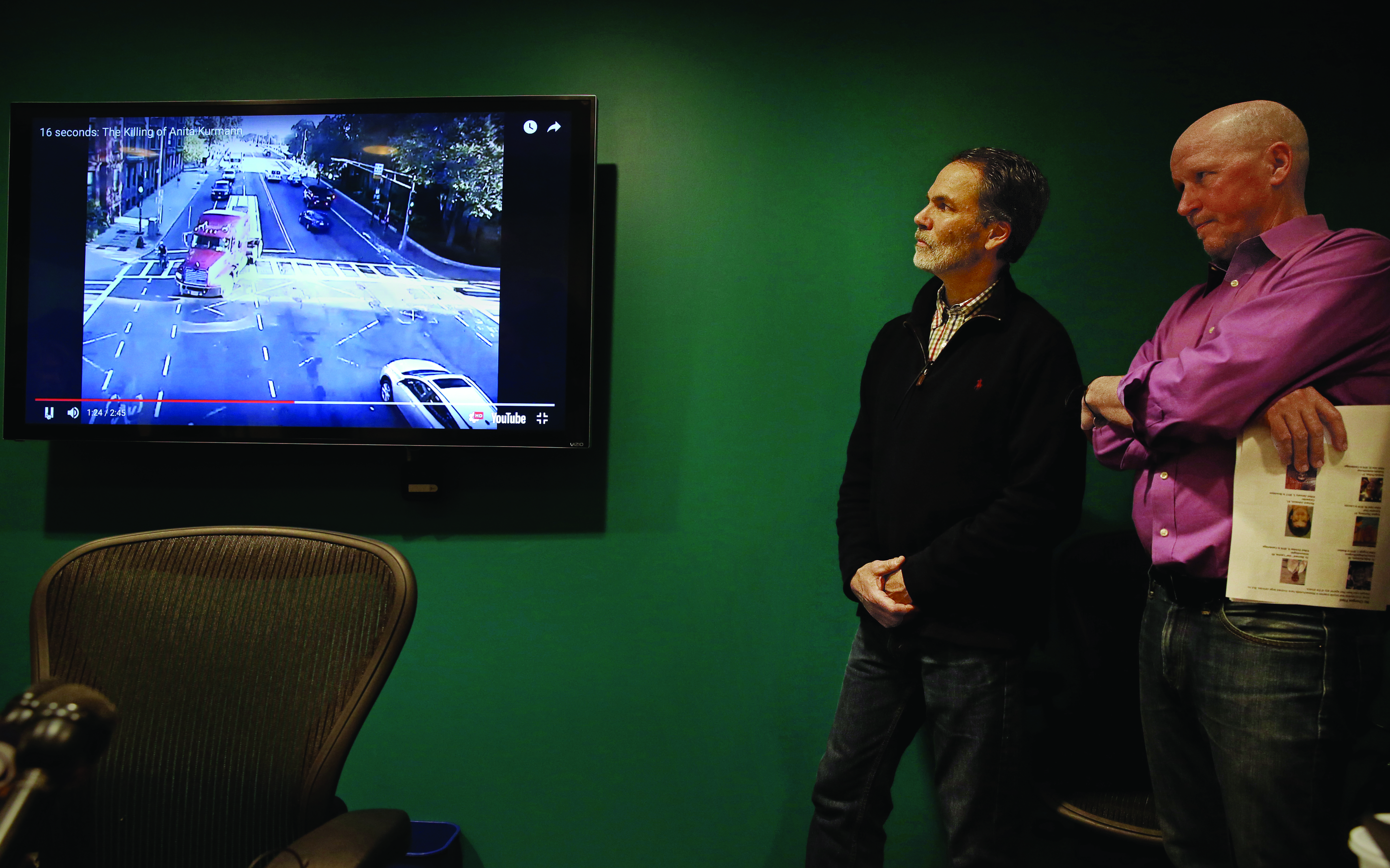 Alan Wright (left), of RozzieBikes, and Richard Fries, executive director of MassBike, used video footage of the fatal accident to help make their case that police should have charged the truck driver.