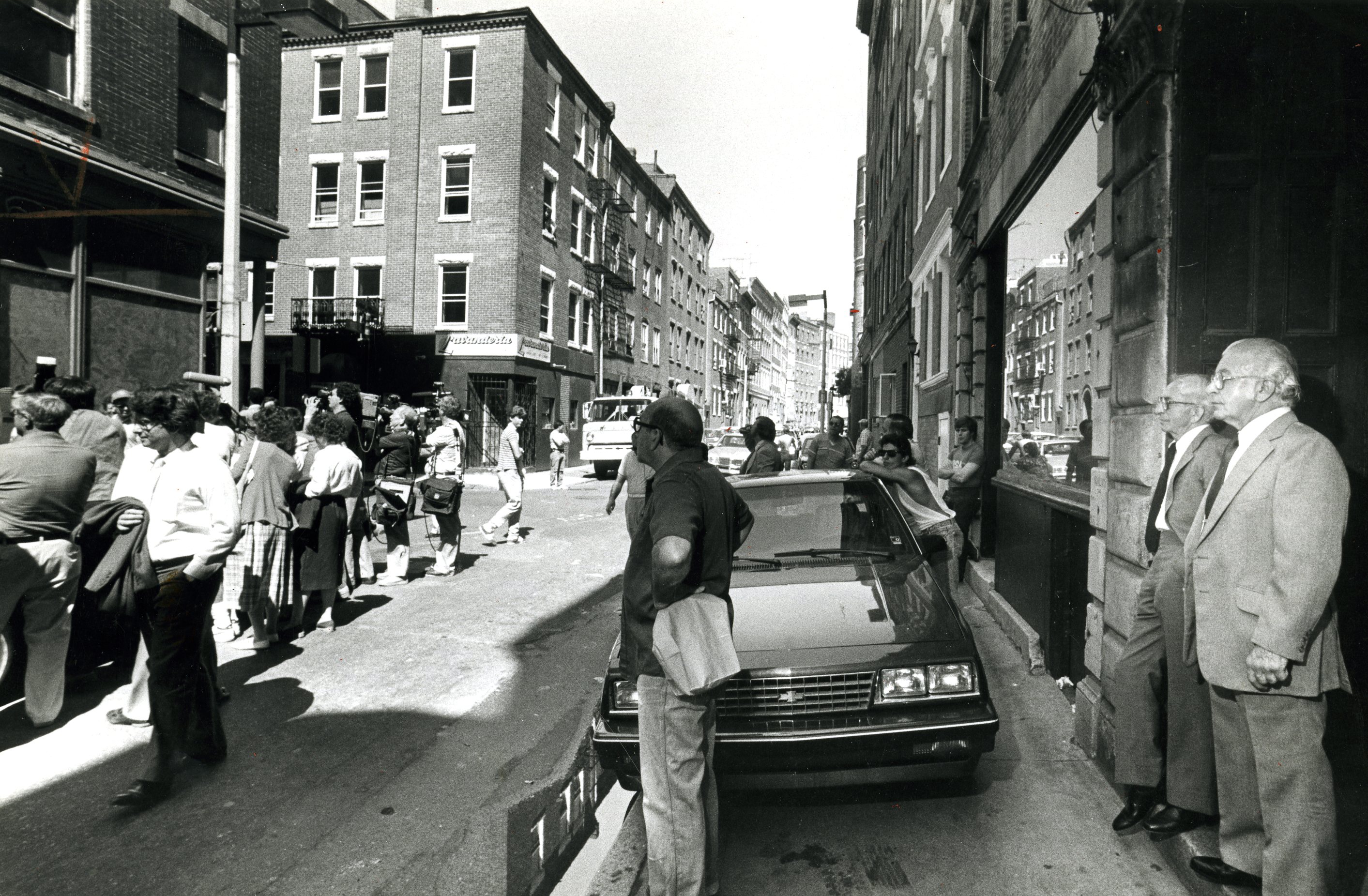 Donato Angiulo (right) and his brother Francesco watched a jury visiting their Prince Street offices in 1985.