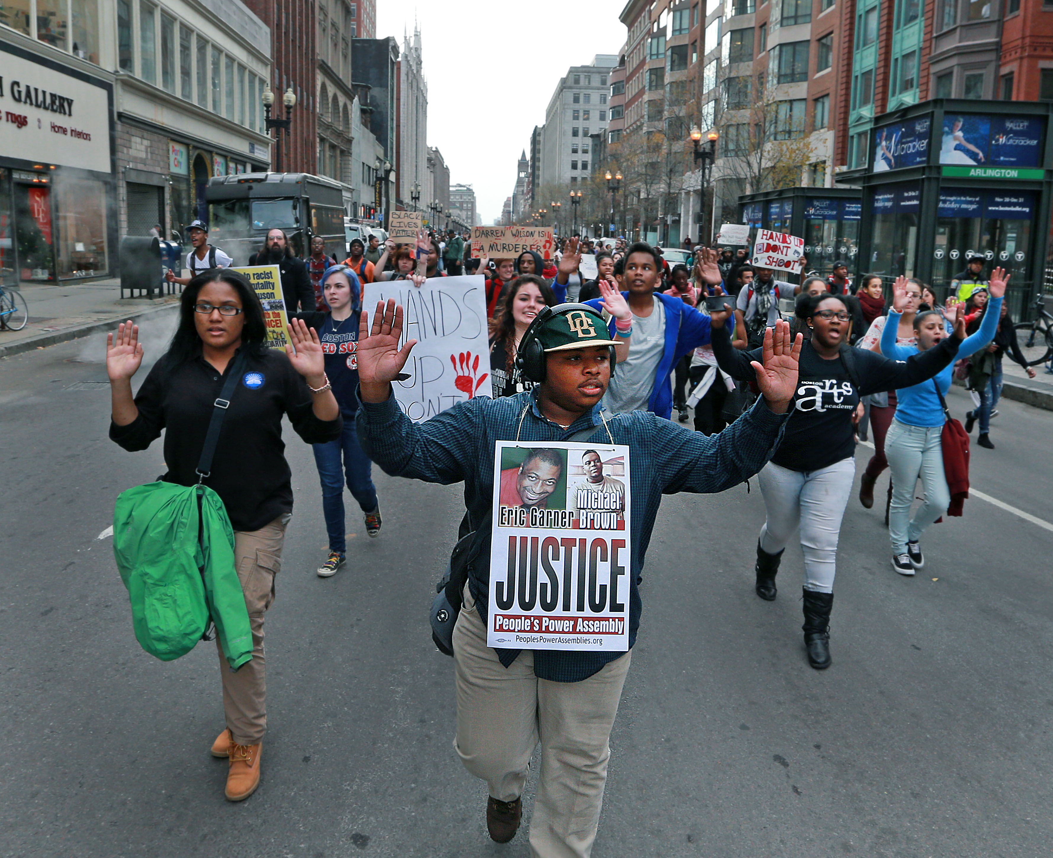 Students marched and chanted as they walked down the middle of Boylston Street in Boston.