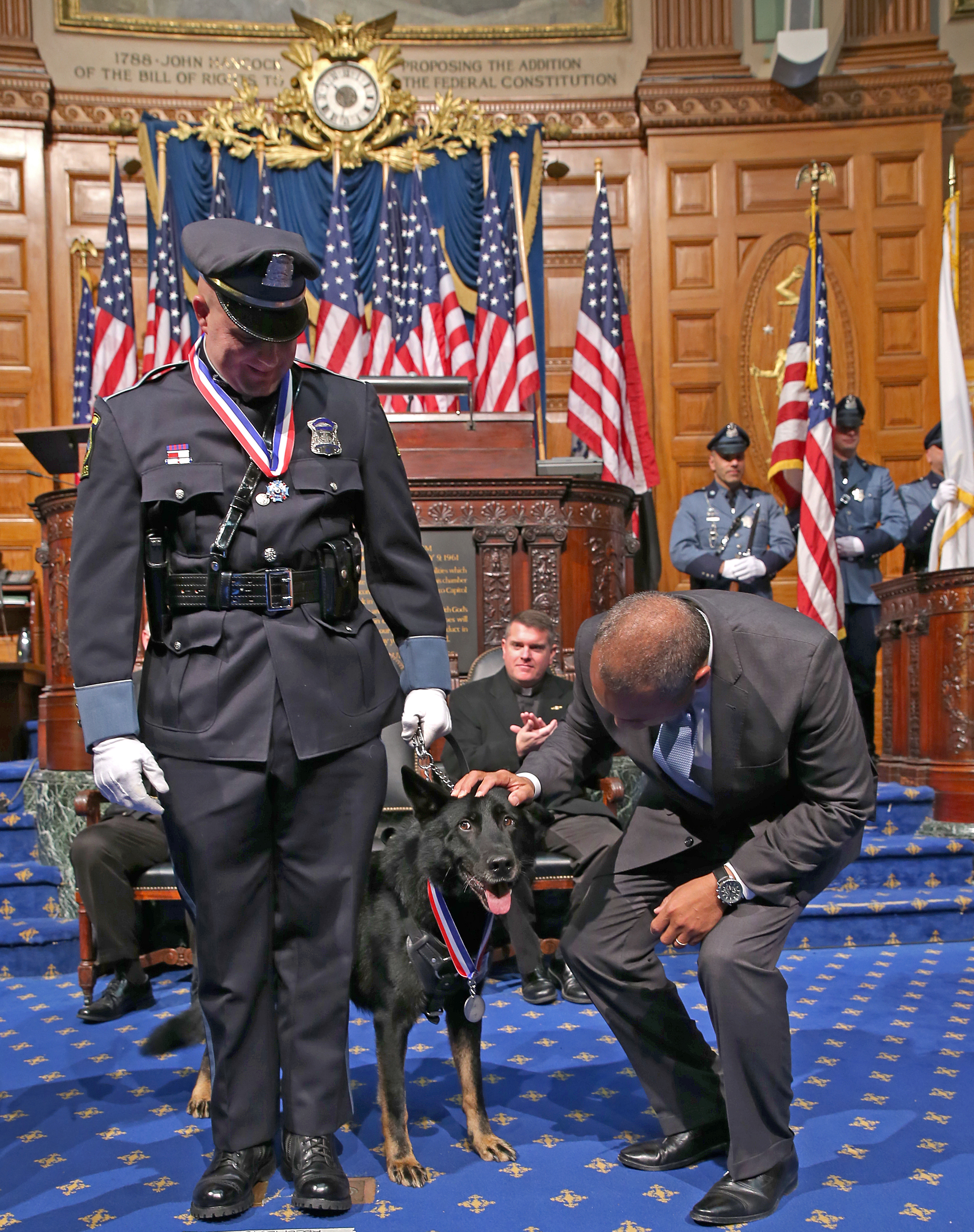 Ashland Police Officer Christopher E. Alberini along with his partner Dax were awarded the Medal Of Valor. Governor Patrick gave Dax a pat on the head.