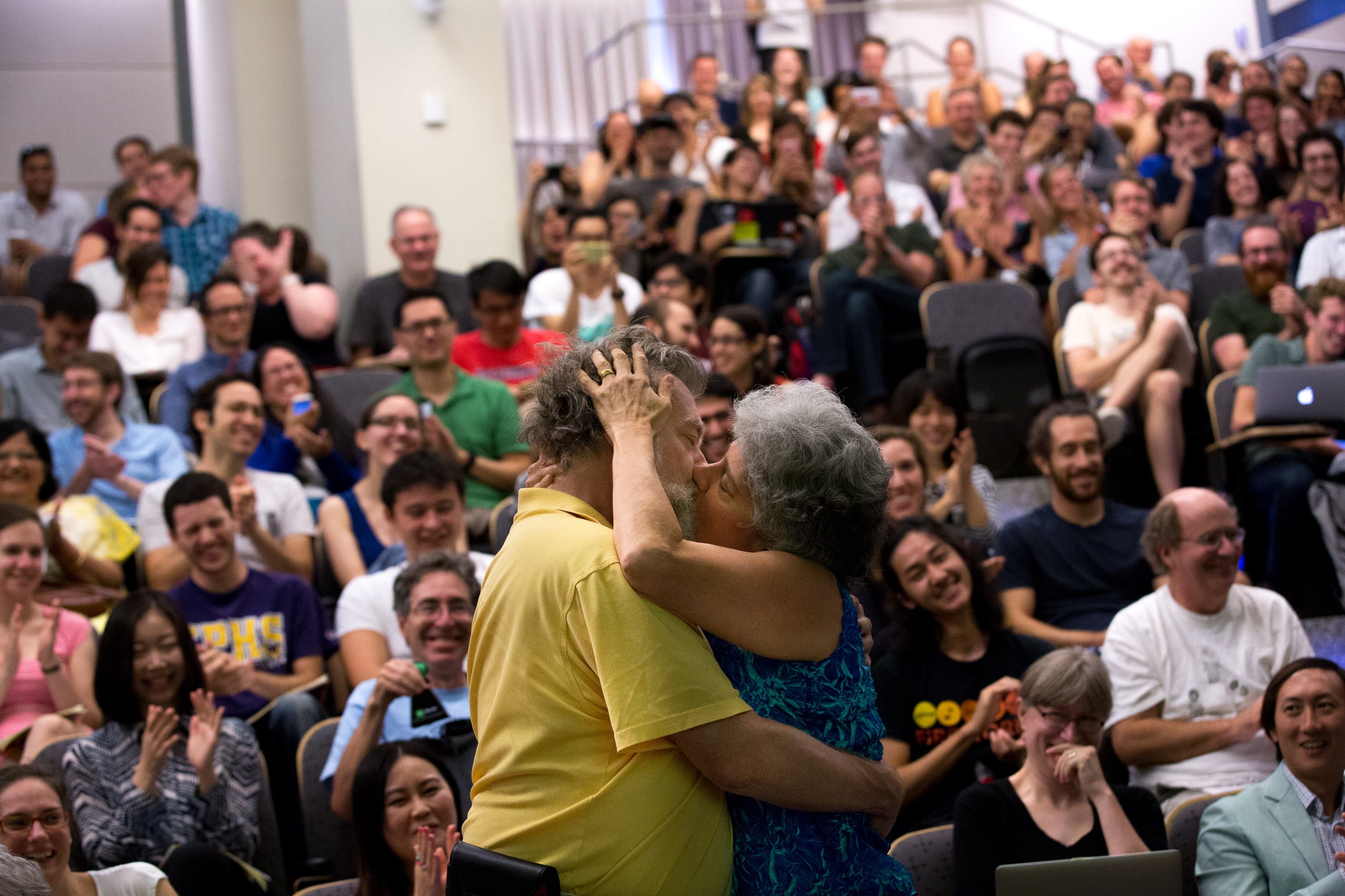 Jim Carey (left) and Rachel Carey (right) kiss during a presentation on research on how kissing affects the immune system at the Ig Nobel awards, which honor goofy scientific research, at MIT in Cambridge.