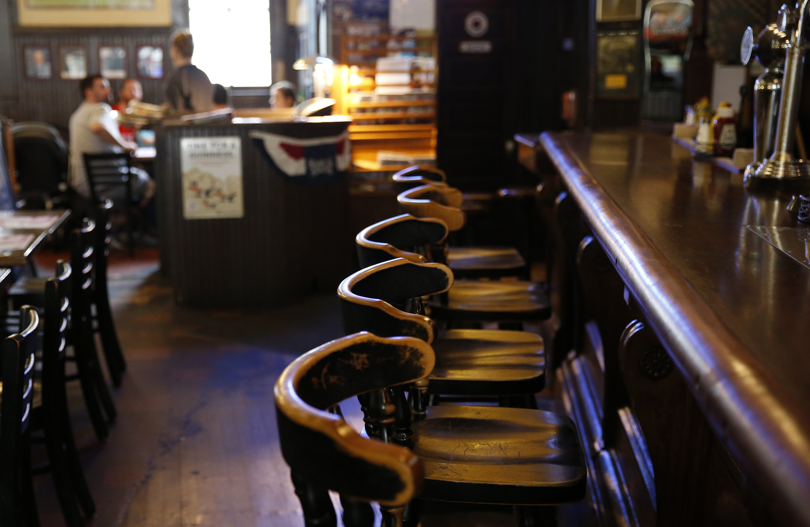 Empty chairs lined the bar inside Doyle’s.