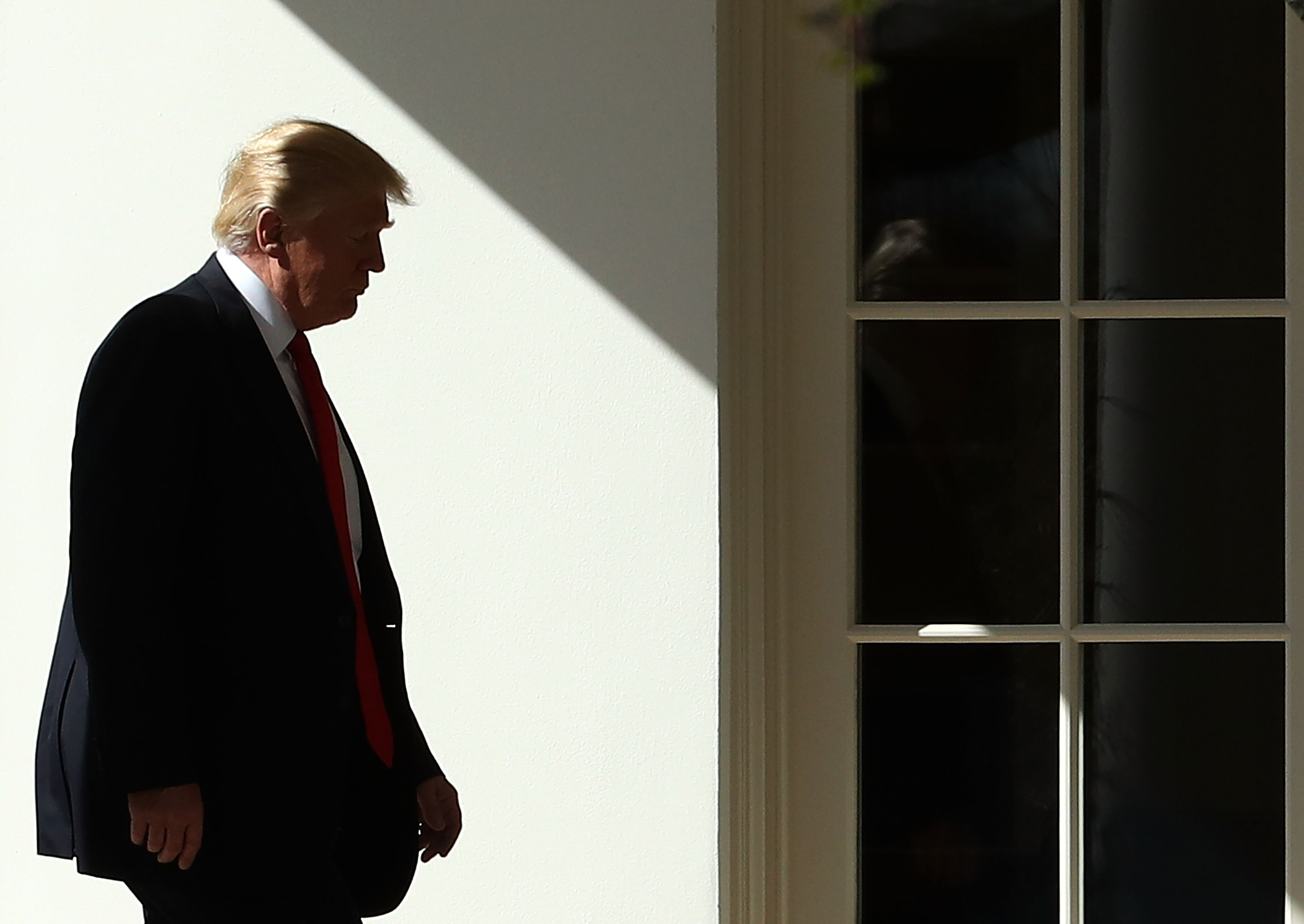 Trump walked to the Oval Office on Friday after returning to the White House.