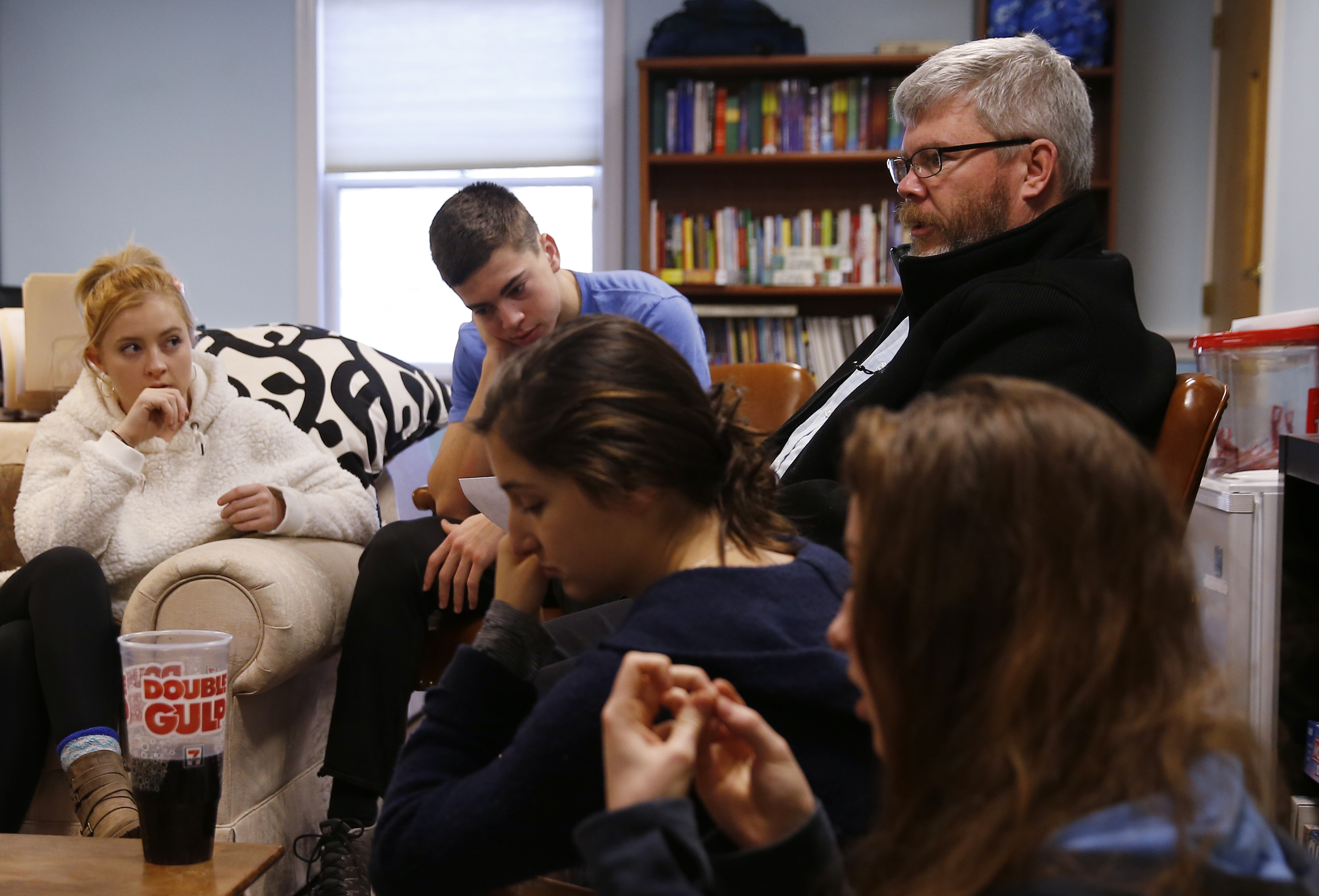 Jim Flanagan, the coordinator of youth ministries at St. Elizabeth Church, met with a group of students from the church to plan upcoming youth ministry events.