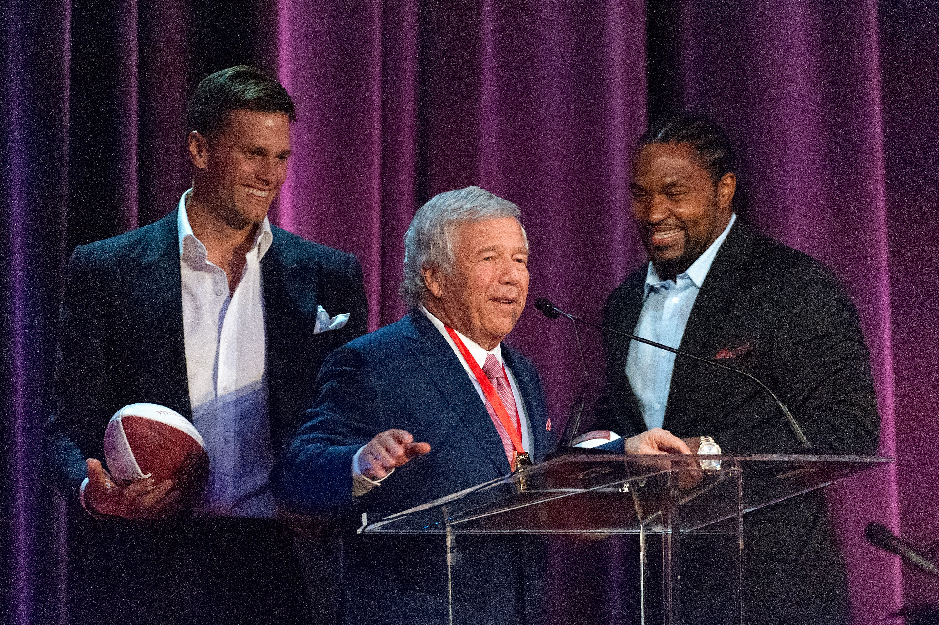 Robert Kraft accepts the award with Tom Brady and Jerod Mayo at the Waldorf Astoria in New York.