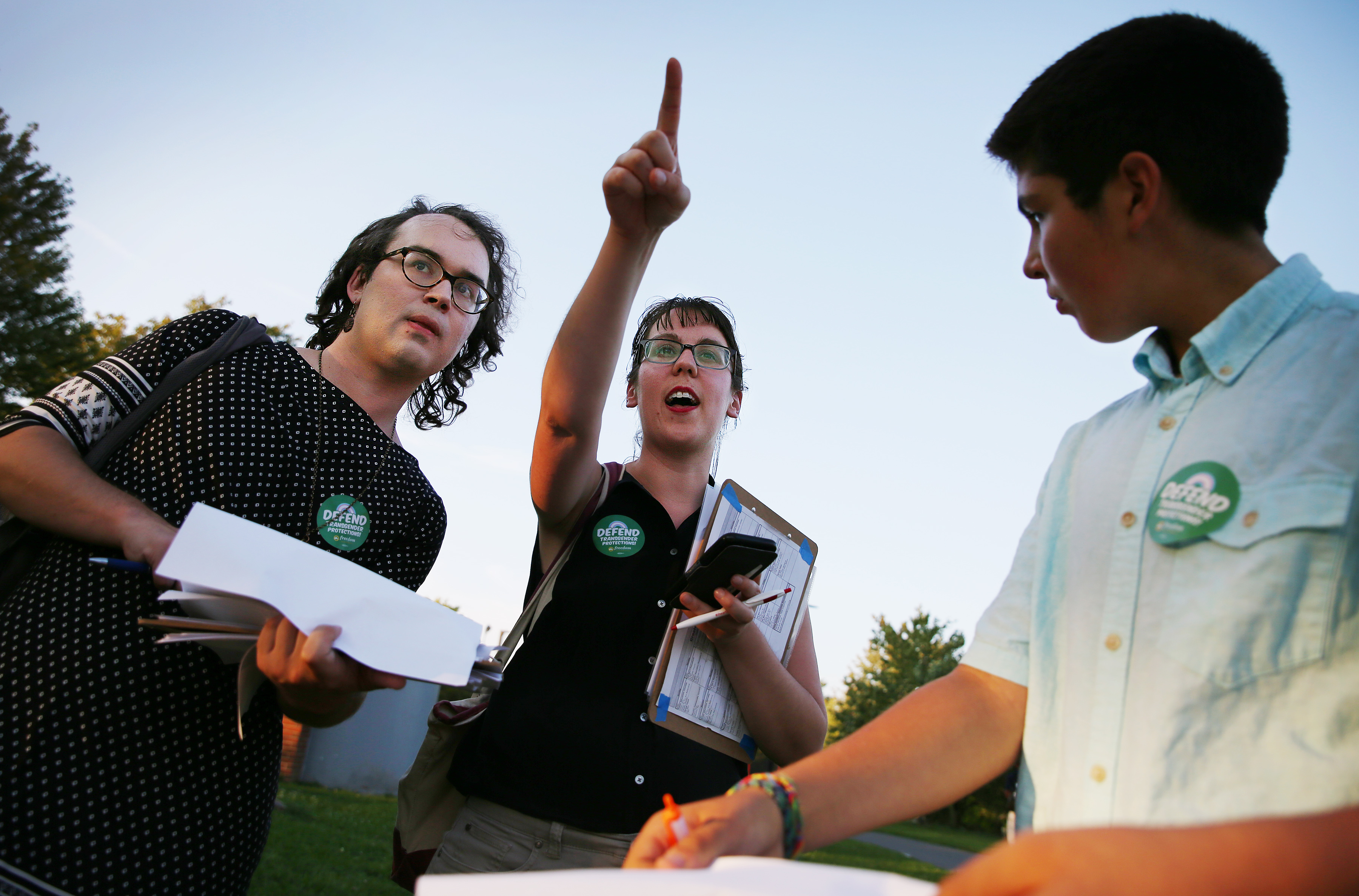 From left, Rogers, Monahan, and Austin-Spooner discussed their canvassing strategy.