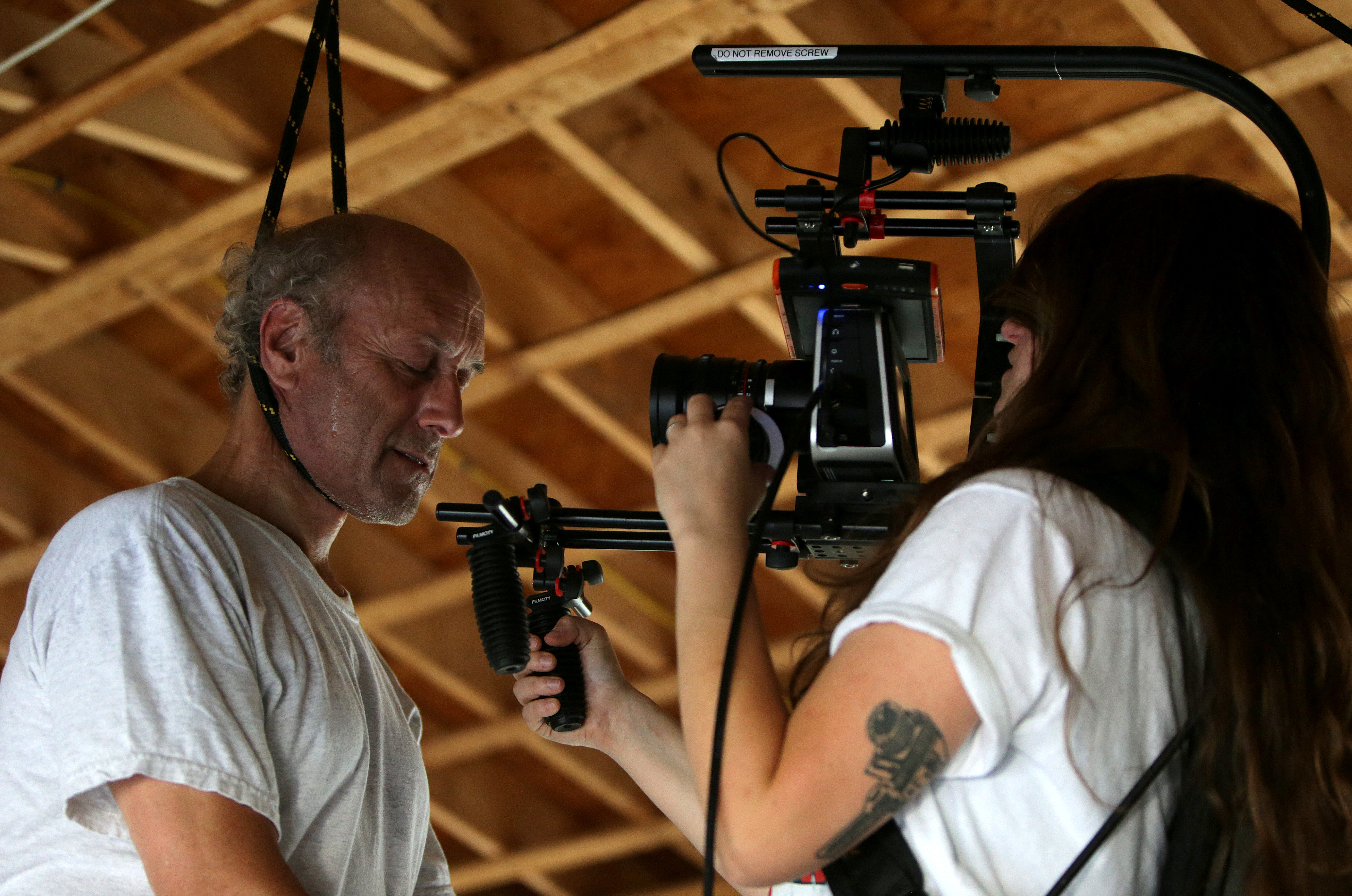 Leticia De Bortoli, director of photography for “Sundown,” preparing to shoot a scene with Paul Kandarian.