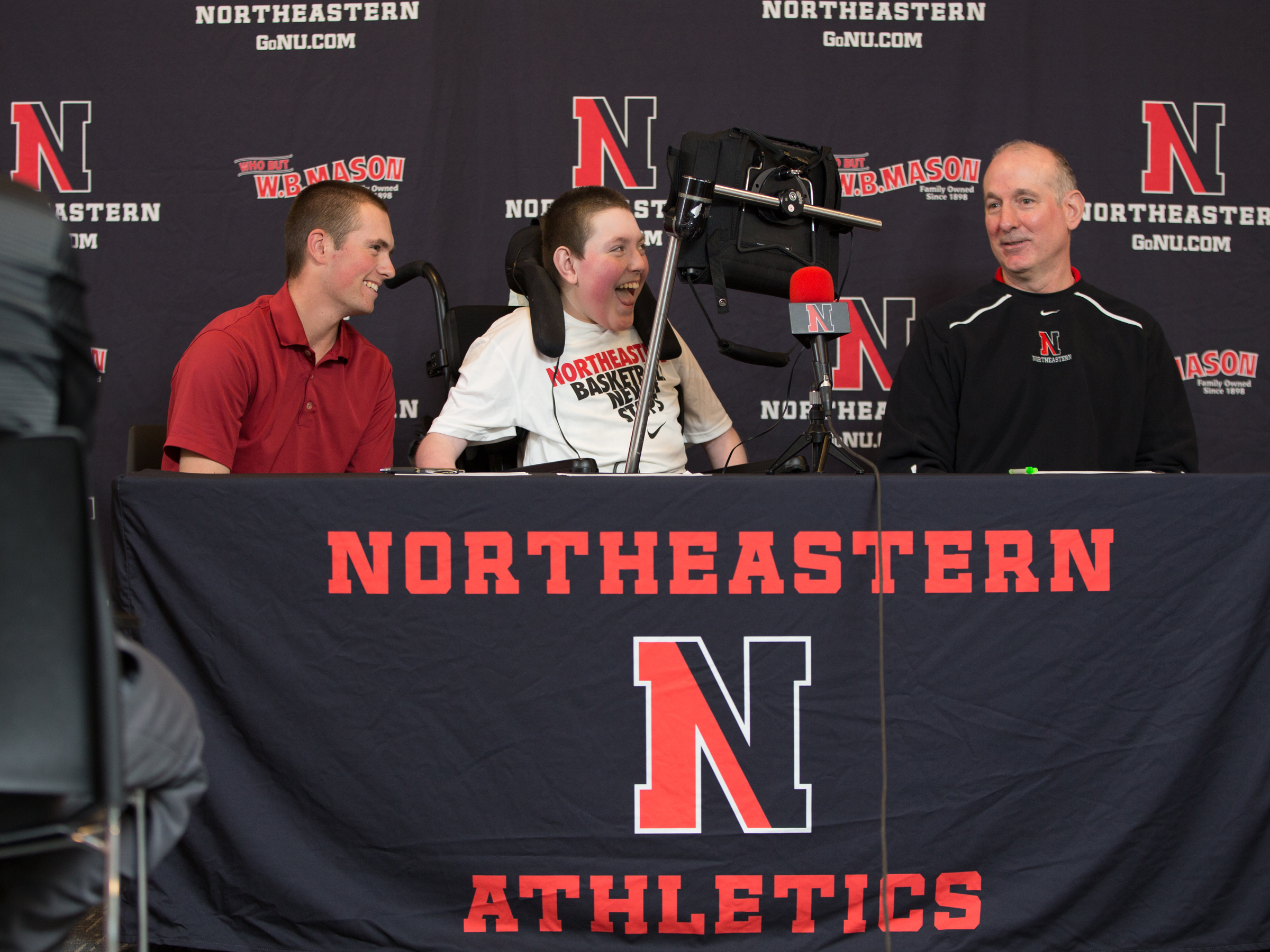 Max Plansky (center) with brother Mike (left) when coach Bill Coen announced Max’s letter of intent in 2013.
