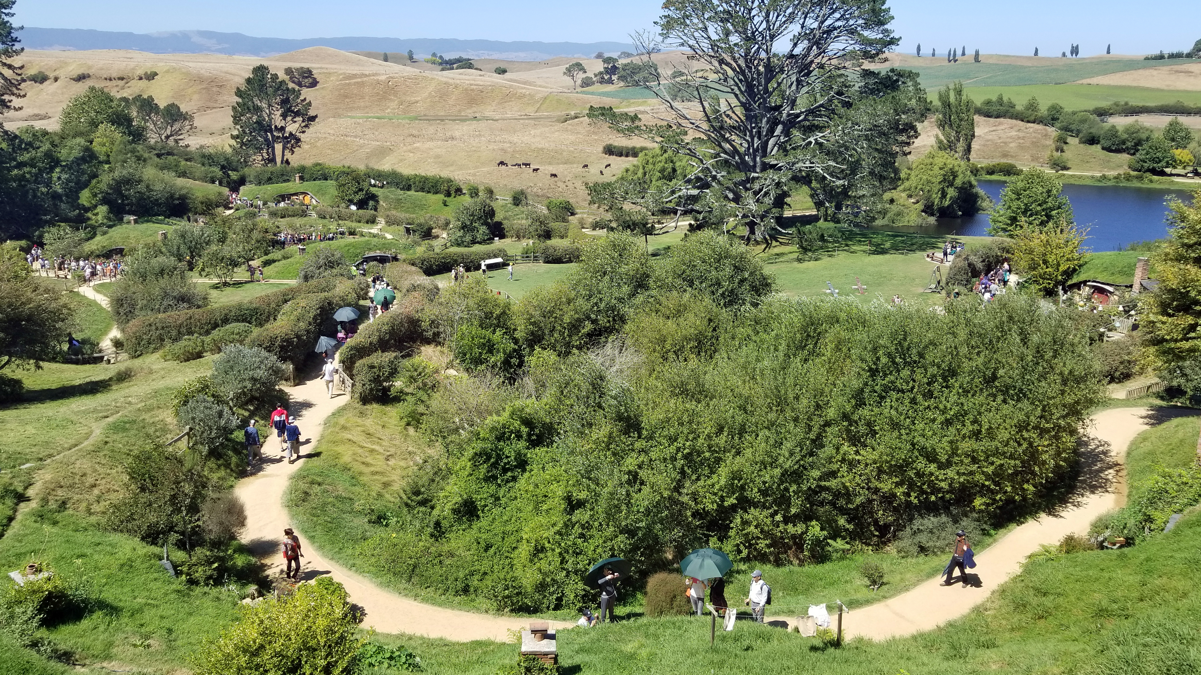 Visitors stroll on the Hobbiton Movie Set in Matamata, New Zealand, where Peter Jackson filmed the movie trilogies "The Lord of the Rings" and "The Hobbit."