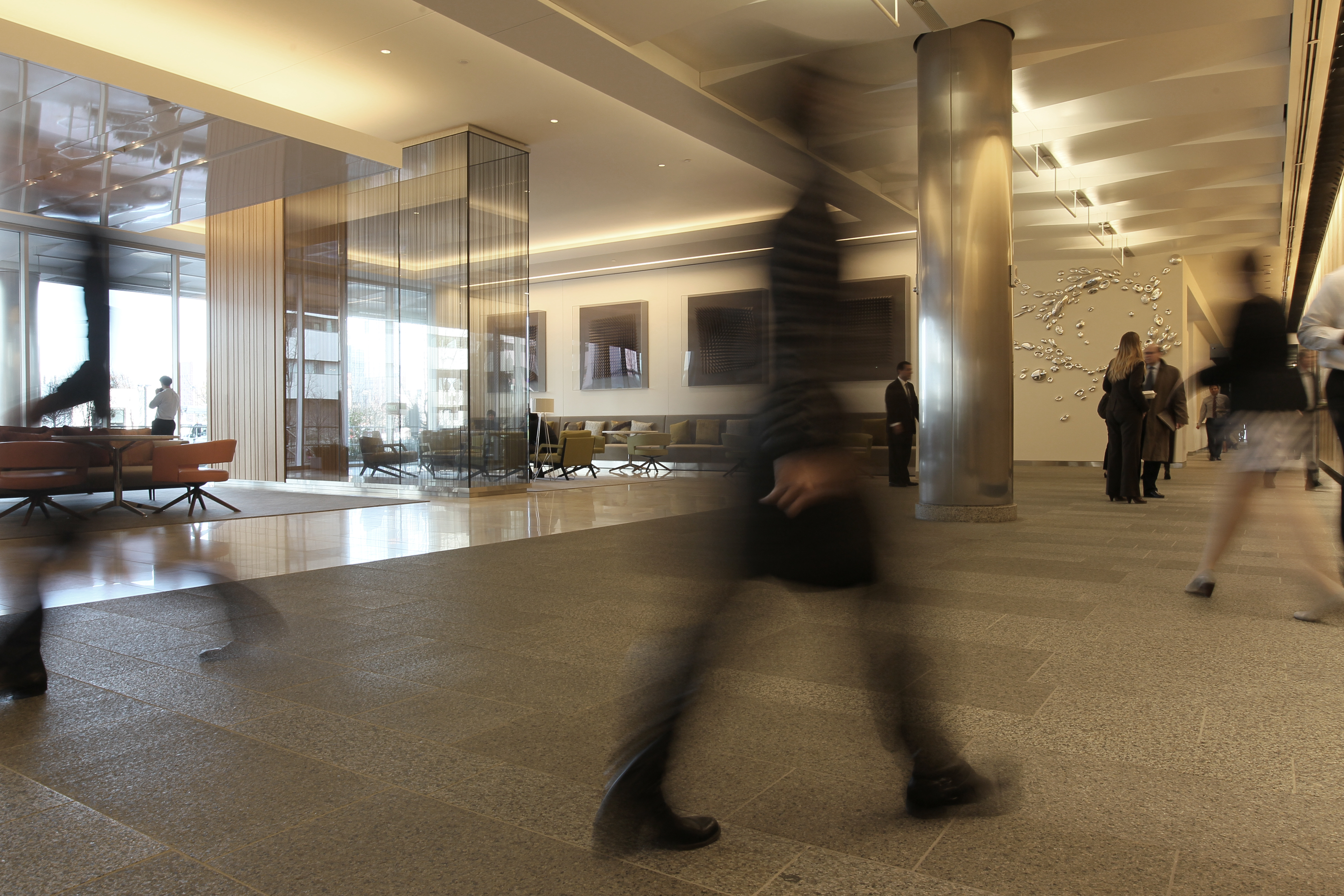 Abigail Johnson moved Fidelity’s headquarters from staid Devonshire Street to the edge of the Seaport district at 245 Summer St. (lobby above).