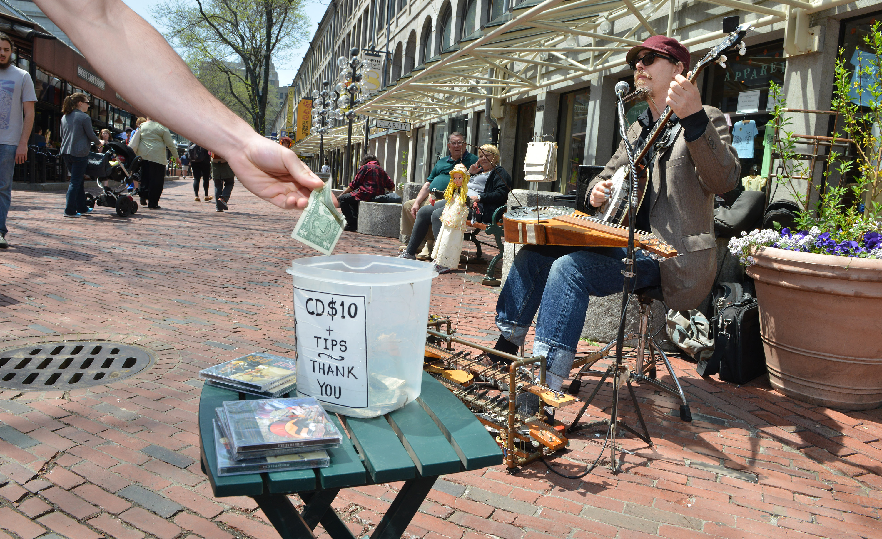Eric Royer performed outside of Quincy Market, where the management company is seeking to impose new rules and fees on buskers who work the area.