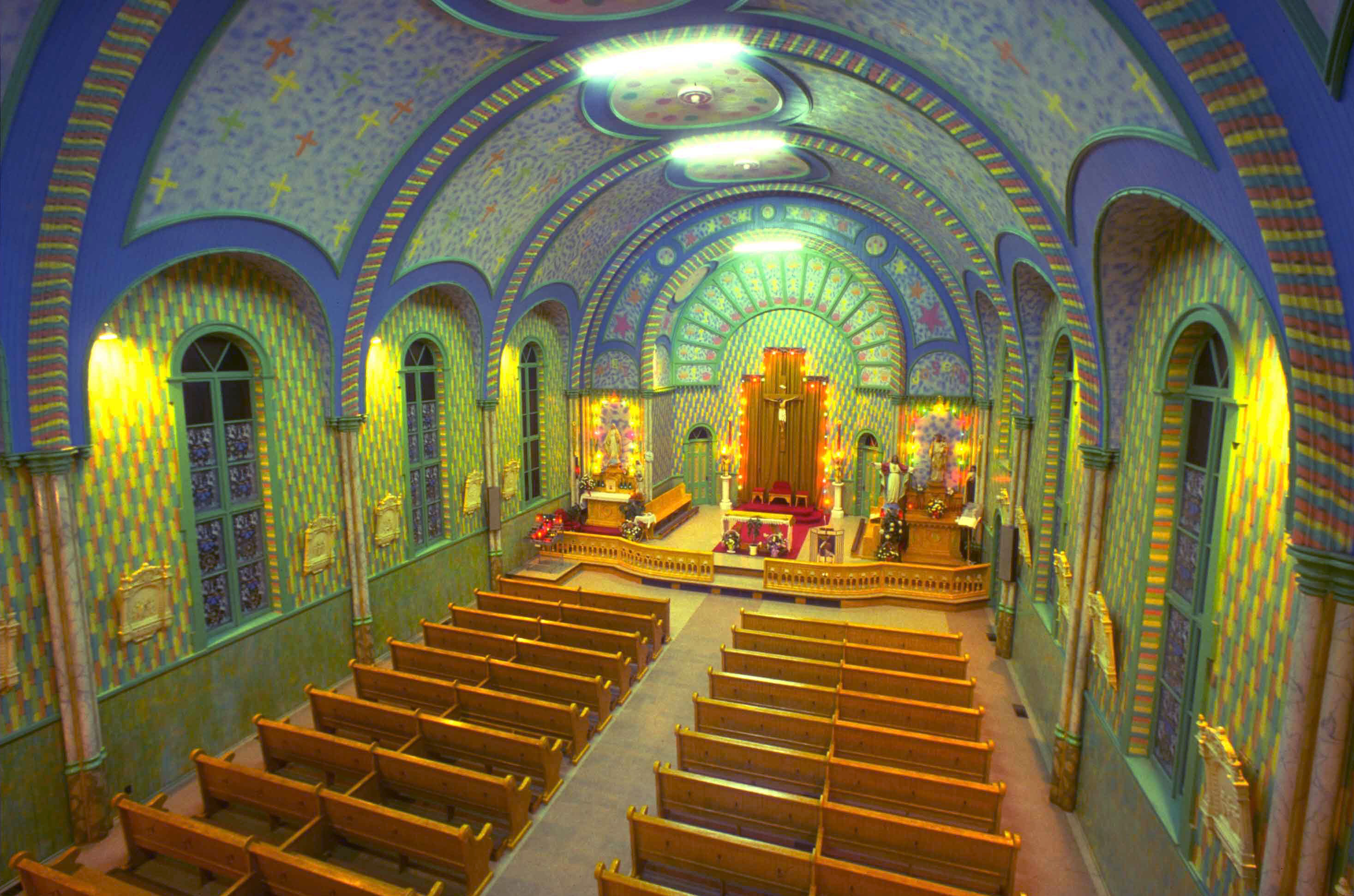 Inside the plain white Sainte-Cècile Church in Petite-Rivière-de-l’Île is a glorious display of colors.