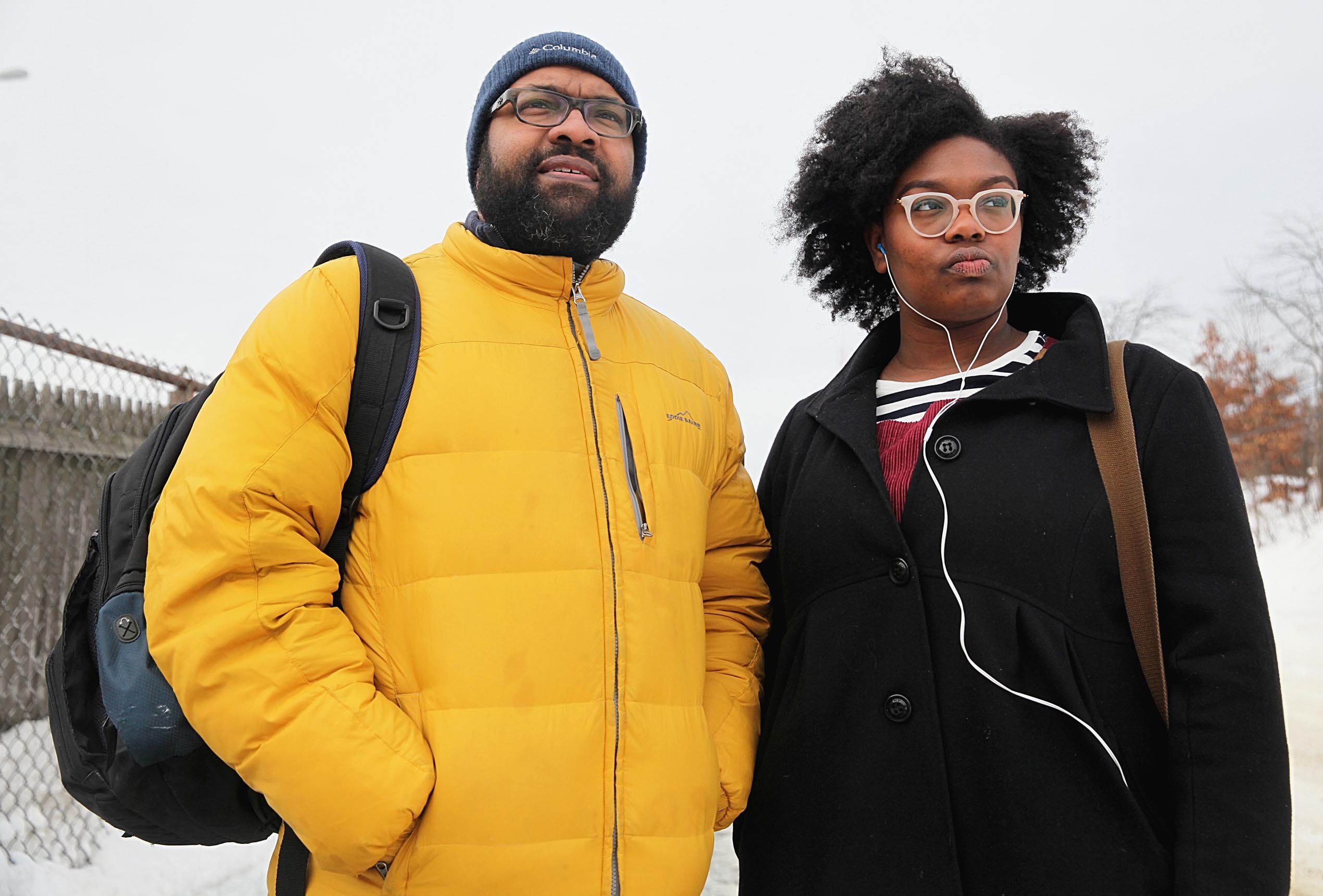 At the West Newton commuter rail stop, Jabari Asim and his daughter, Indigo waited for a delayed inbound train.