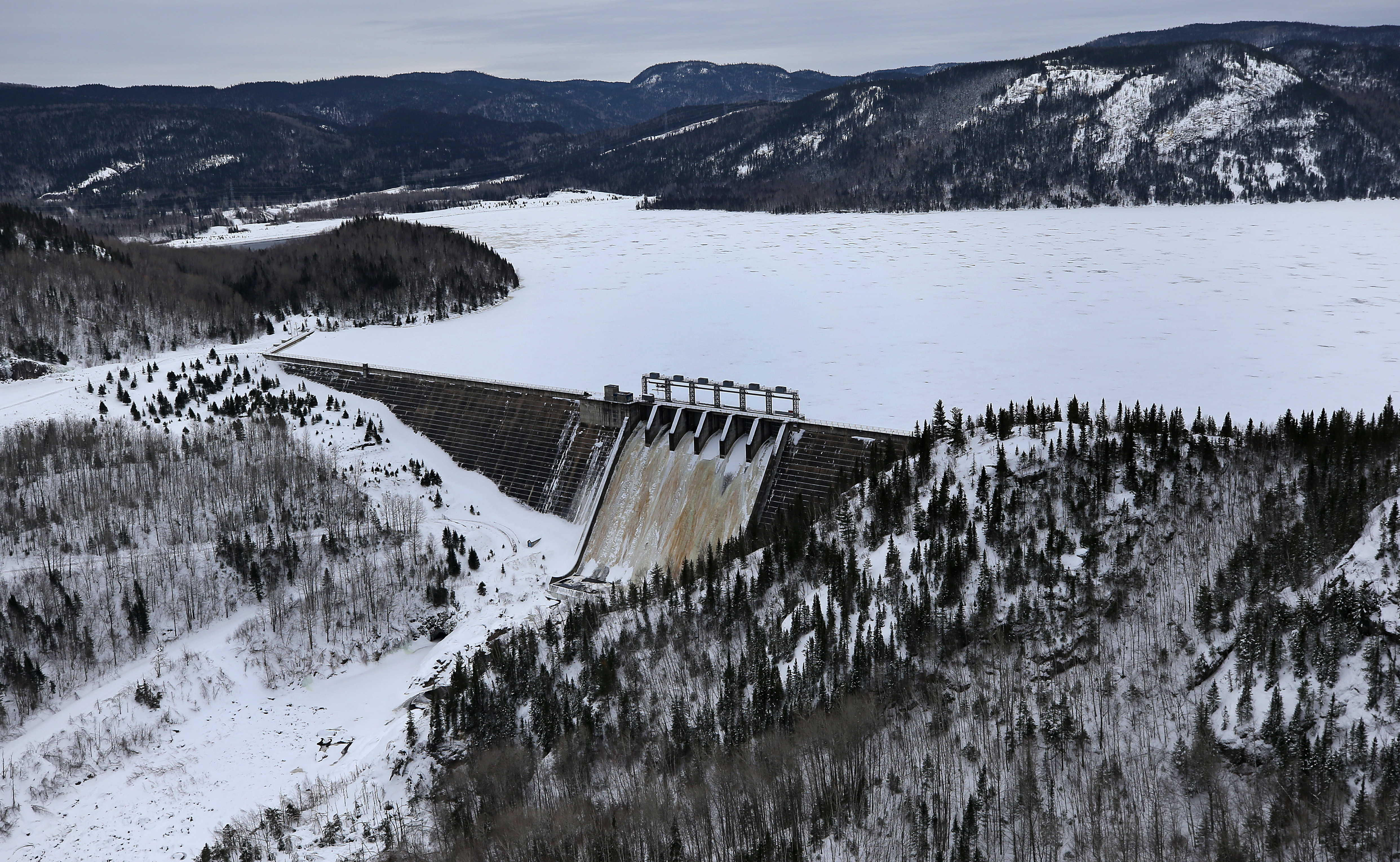The Bersimis-1 plant’s outflow canal feeds into the Betsiamites River below a mountain 50 miles north of the St. Lawrence River