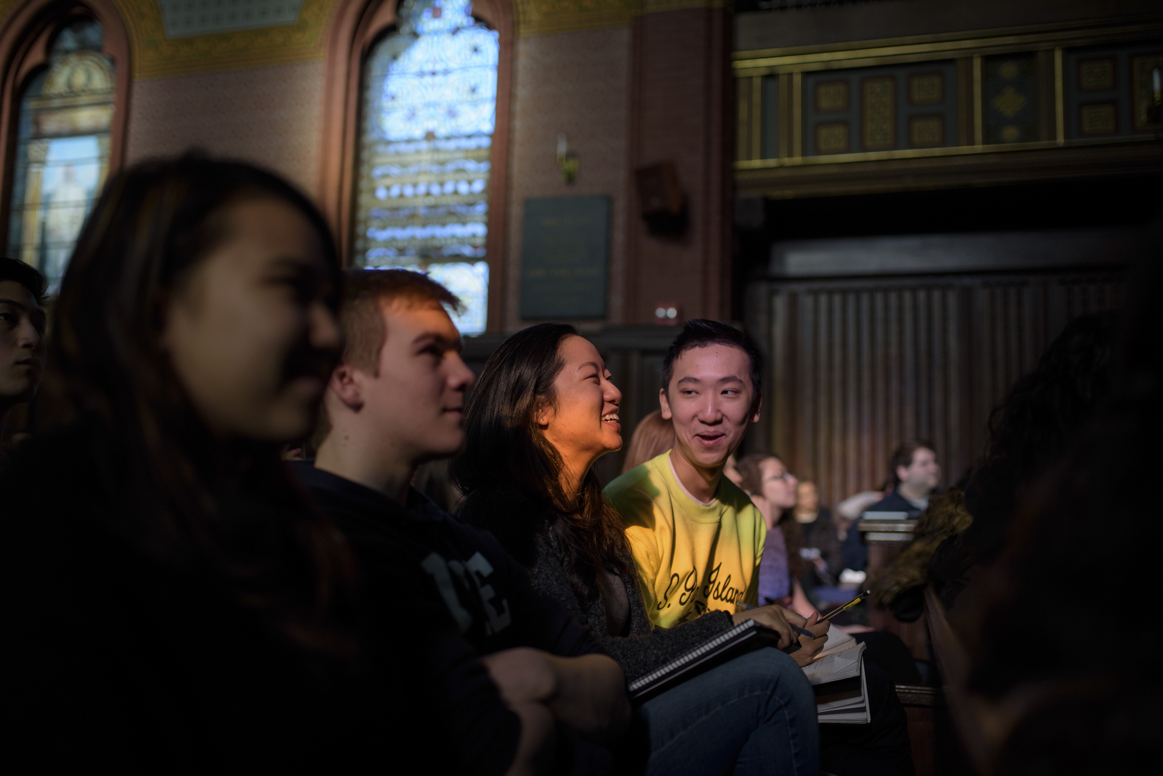 Jennifer Chen, left, and Sean Guo laughed during their "Psychology and the Good Life" class in Battell Chapel at Yale University.