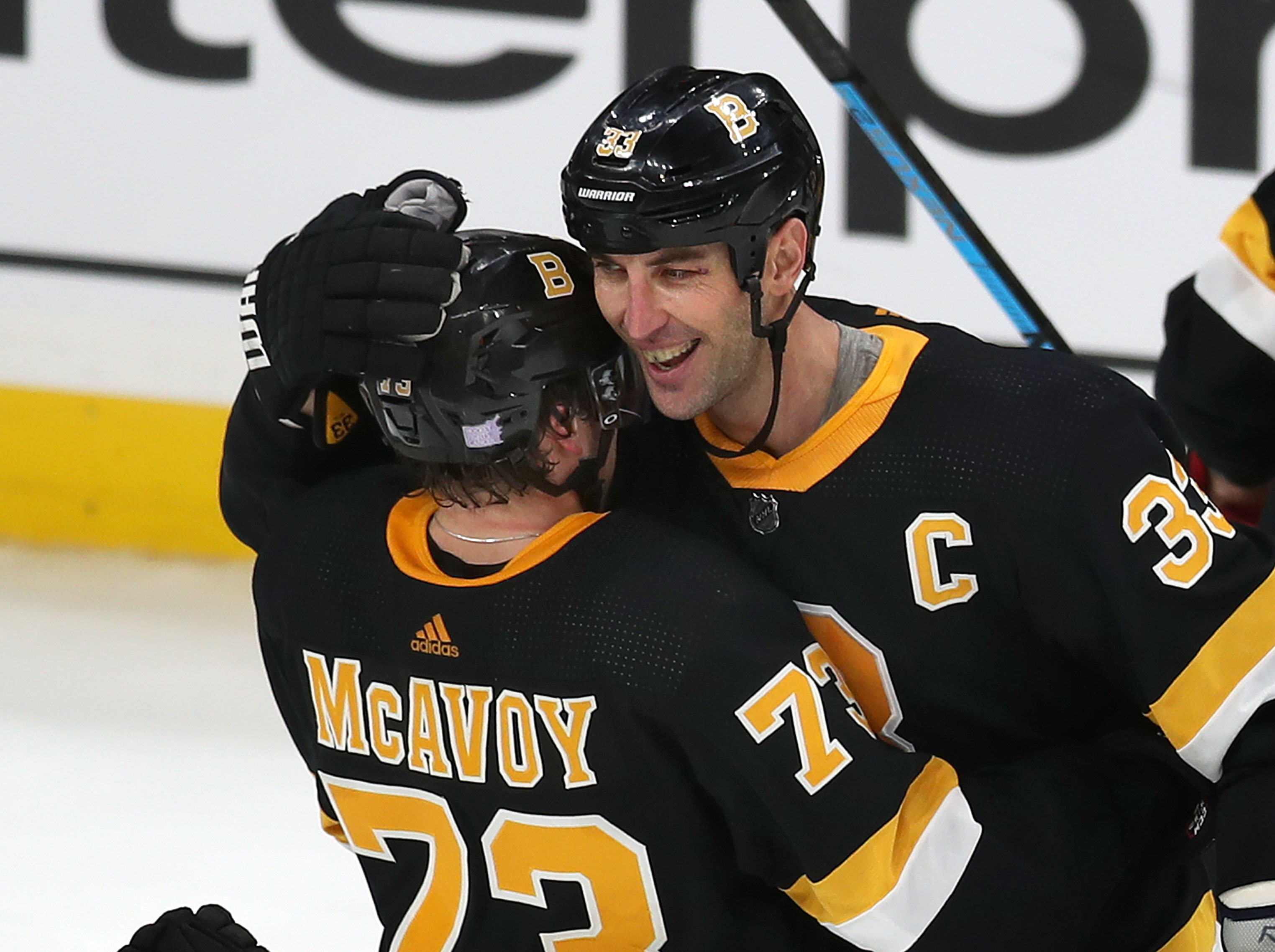 Zdeno Chara hugged Charlie McAvoy after a Bruins overtime win earlier this season.