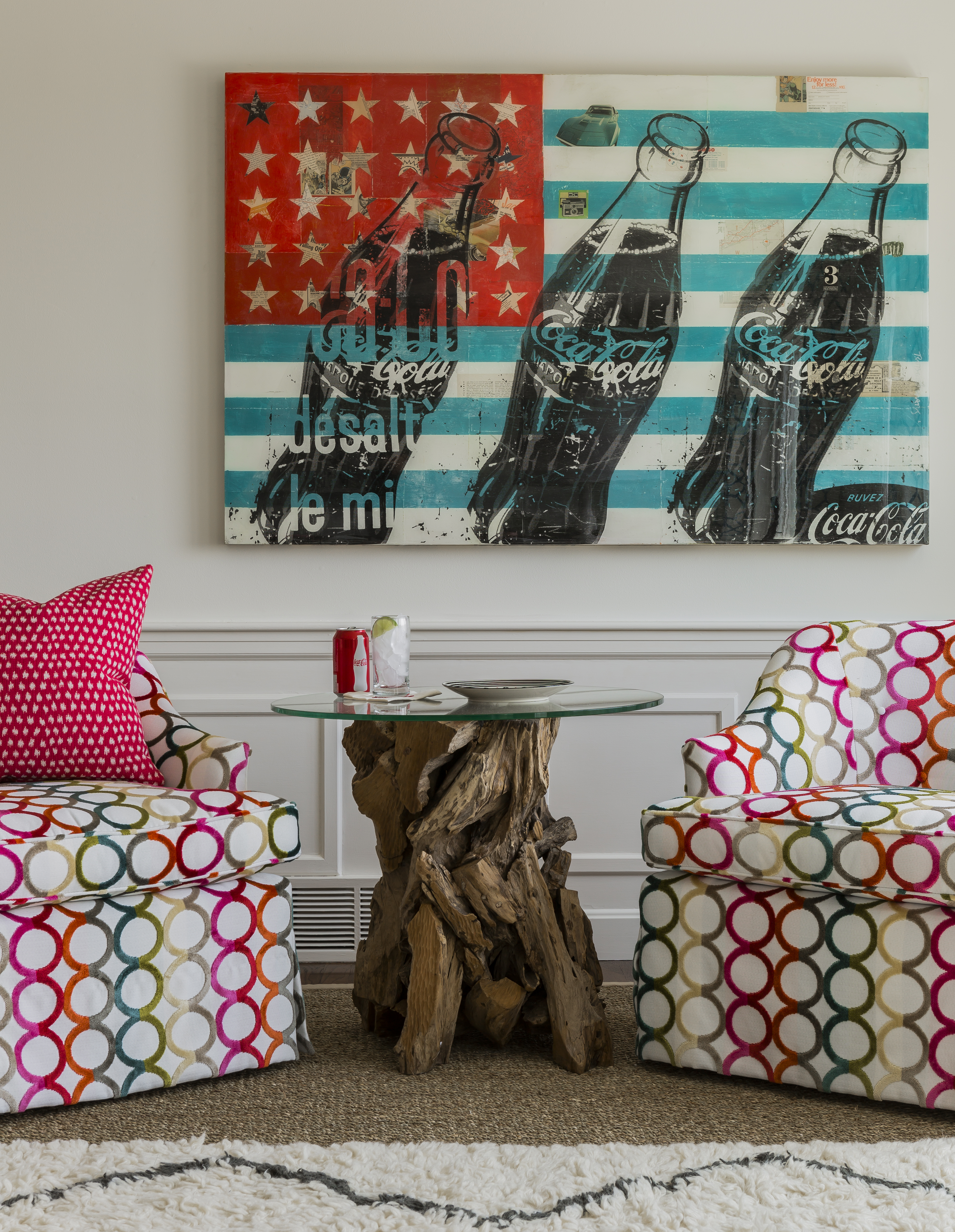 This Robert Mars collage provided inspiration for the home’s color scheme; the chairs are upholstered in Kravet fabric by Jonathan Adler.