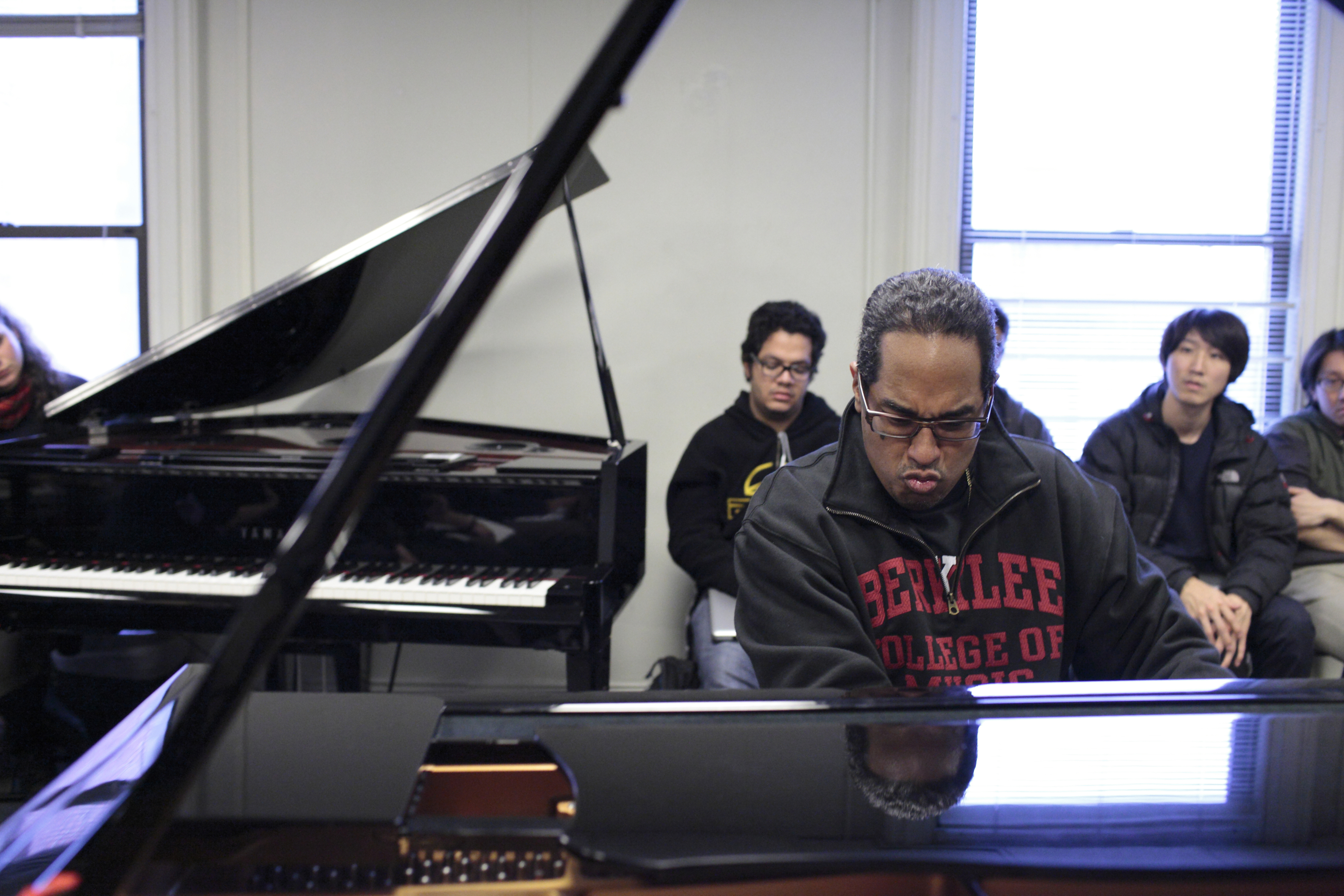 Perez playing in his Berklee classroom.
