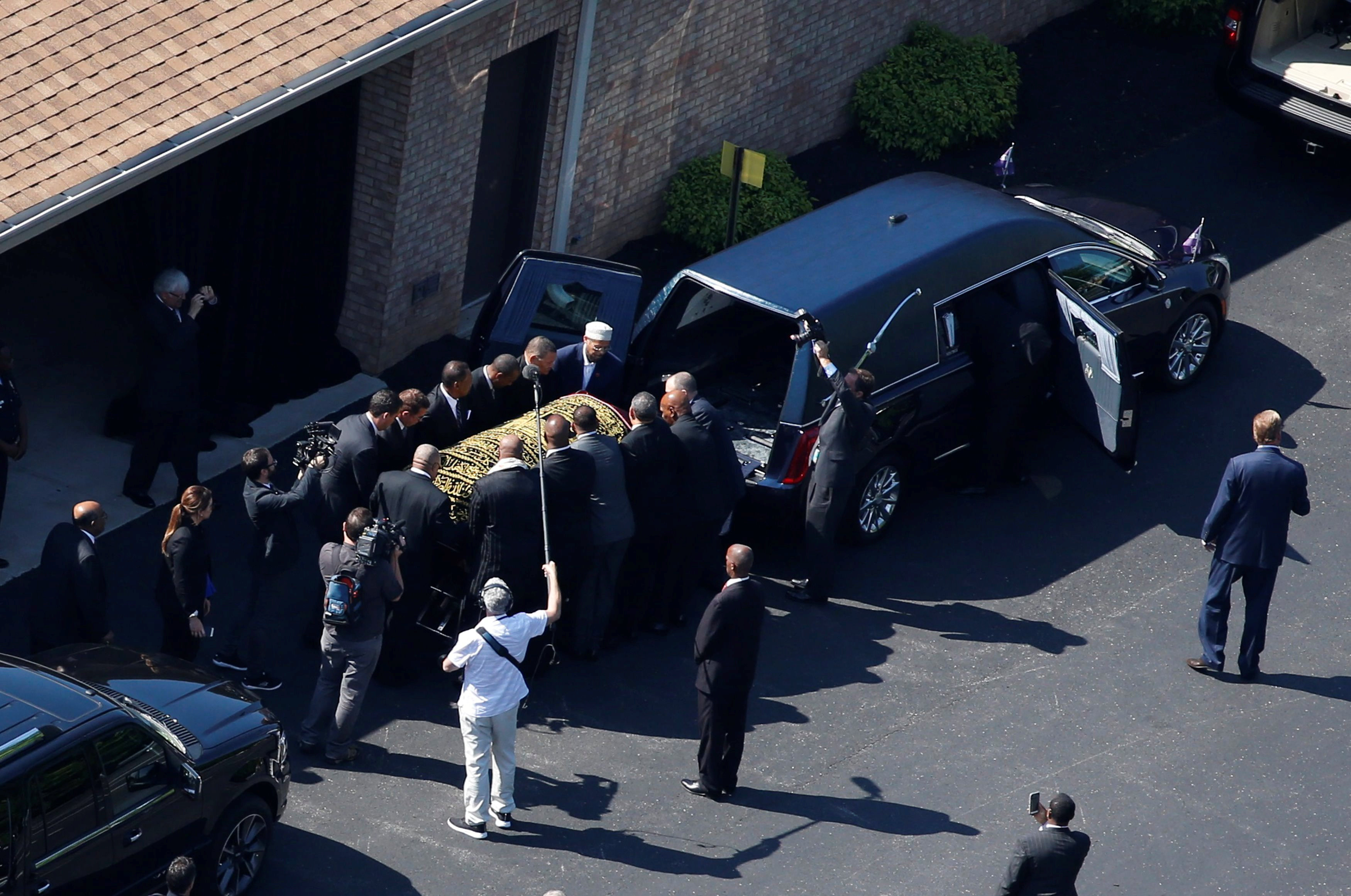 Muhammad Ali’s coffin was loaded into a hearse before the start of Friday’s procession through Louisville, Ky.