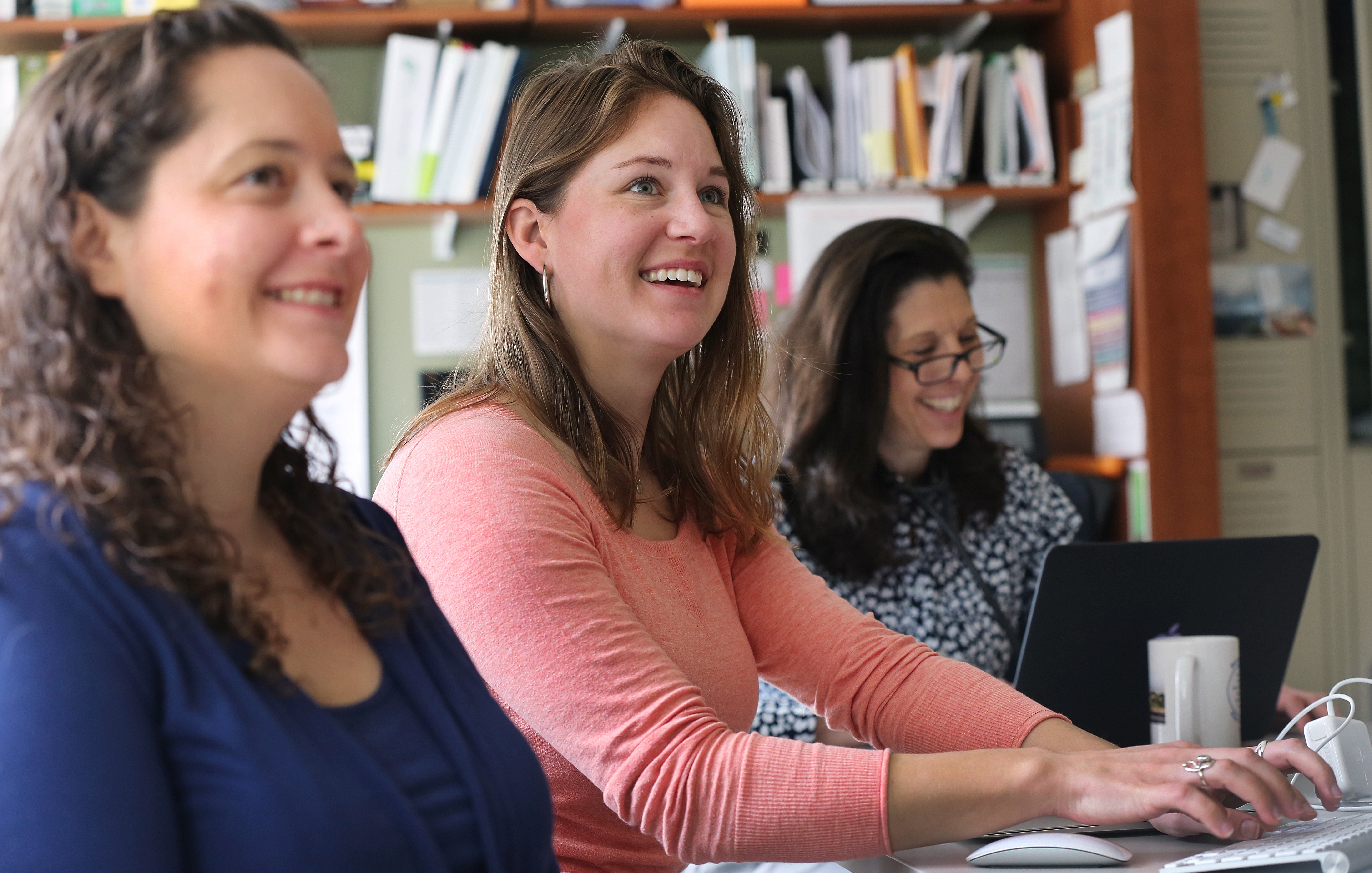 From left, Heather Carroll, Kathryn Evans, and Nancy Cibotti-Granof, who work at Iora Primary Care in Burlington, took part in a daily staff meeting Friday morning.