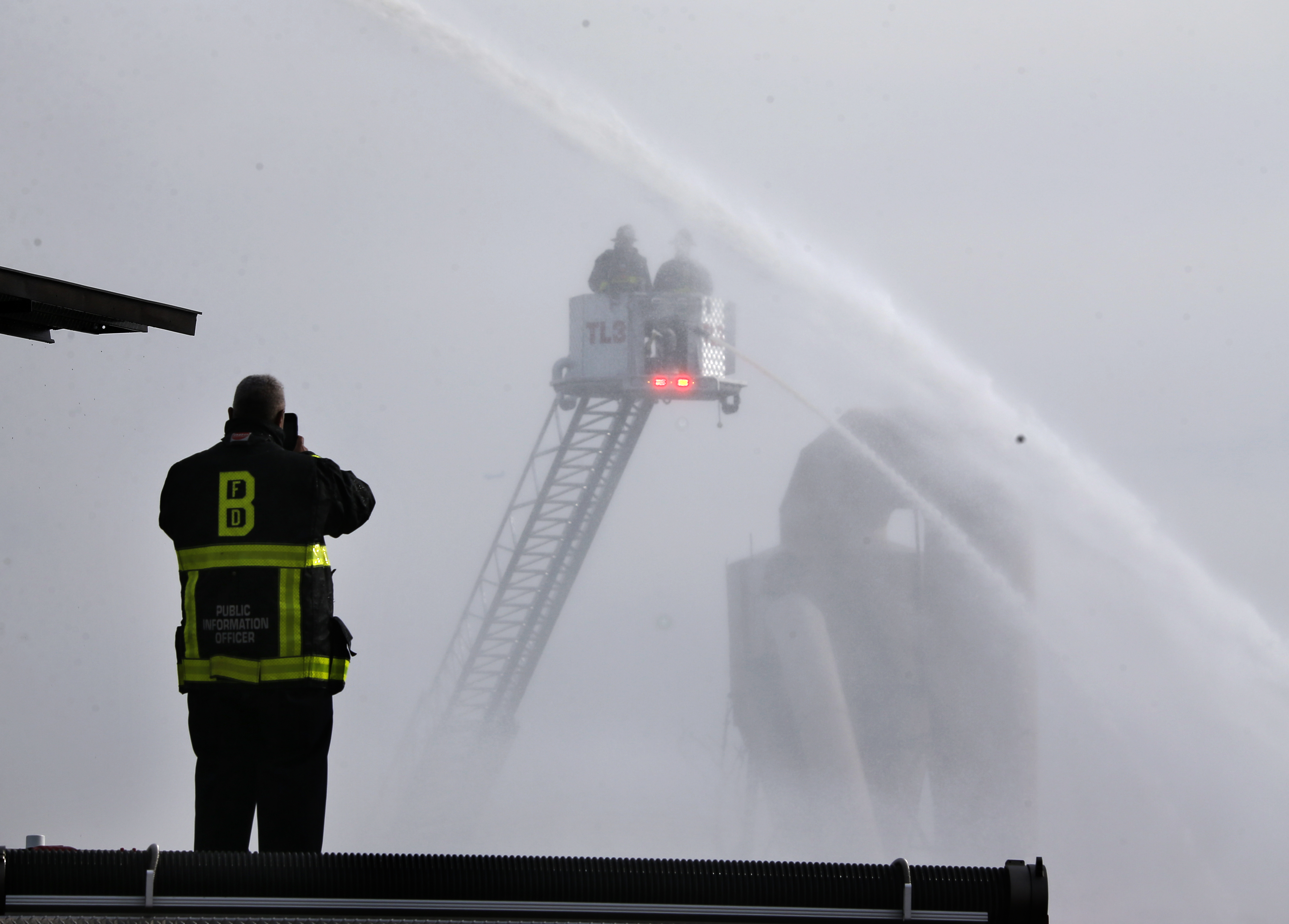 Firefighters on a ladder truck did their best to attack the fire.