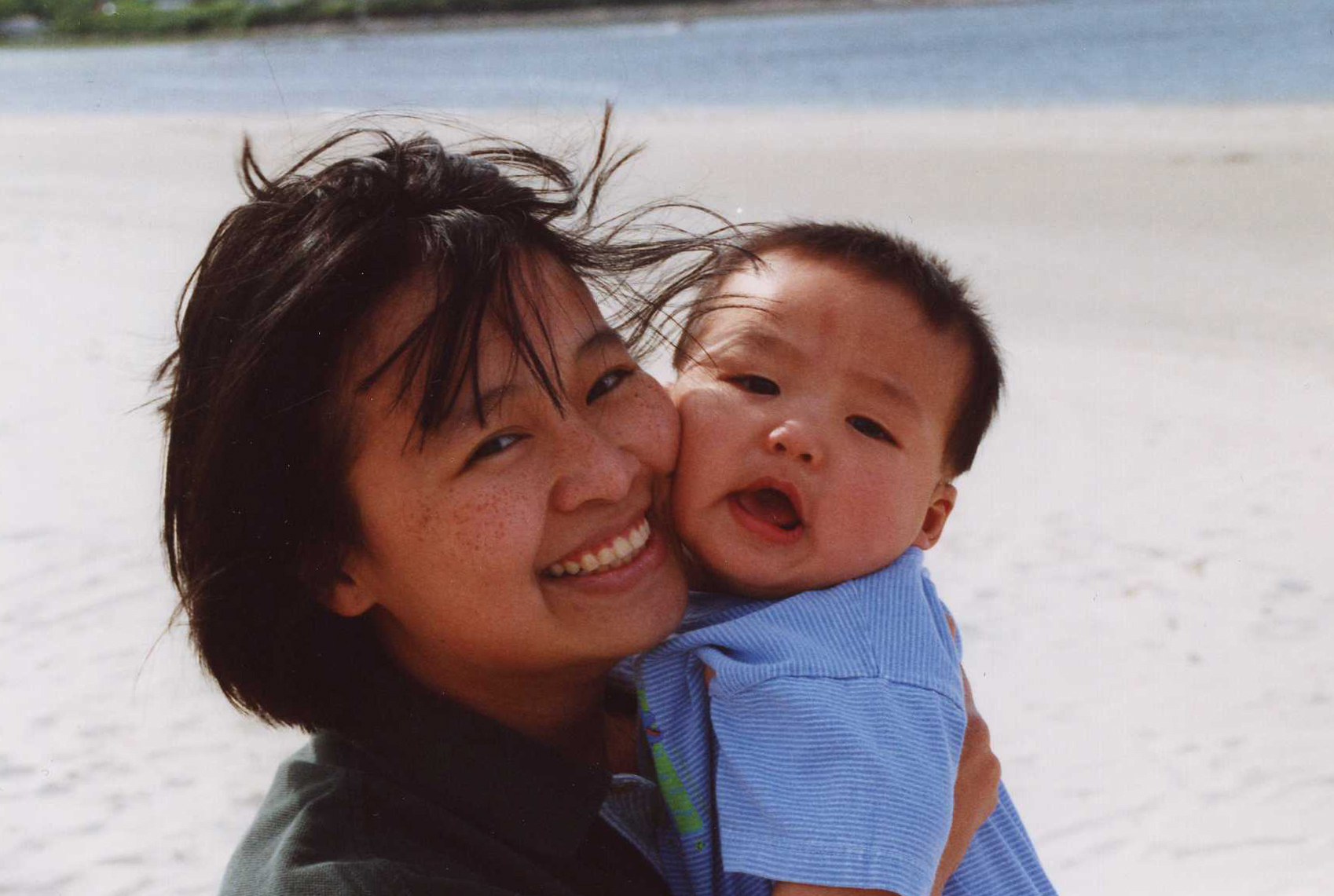 Sheila Lirio Marcelo (shown in 2000 with son Adam) and her husband faced the challenge of finding care for two children they raised during college, grad school, and their early career years.
