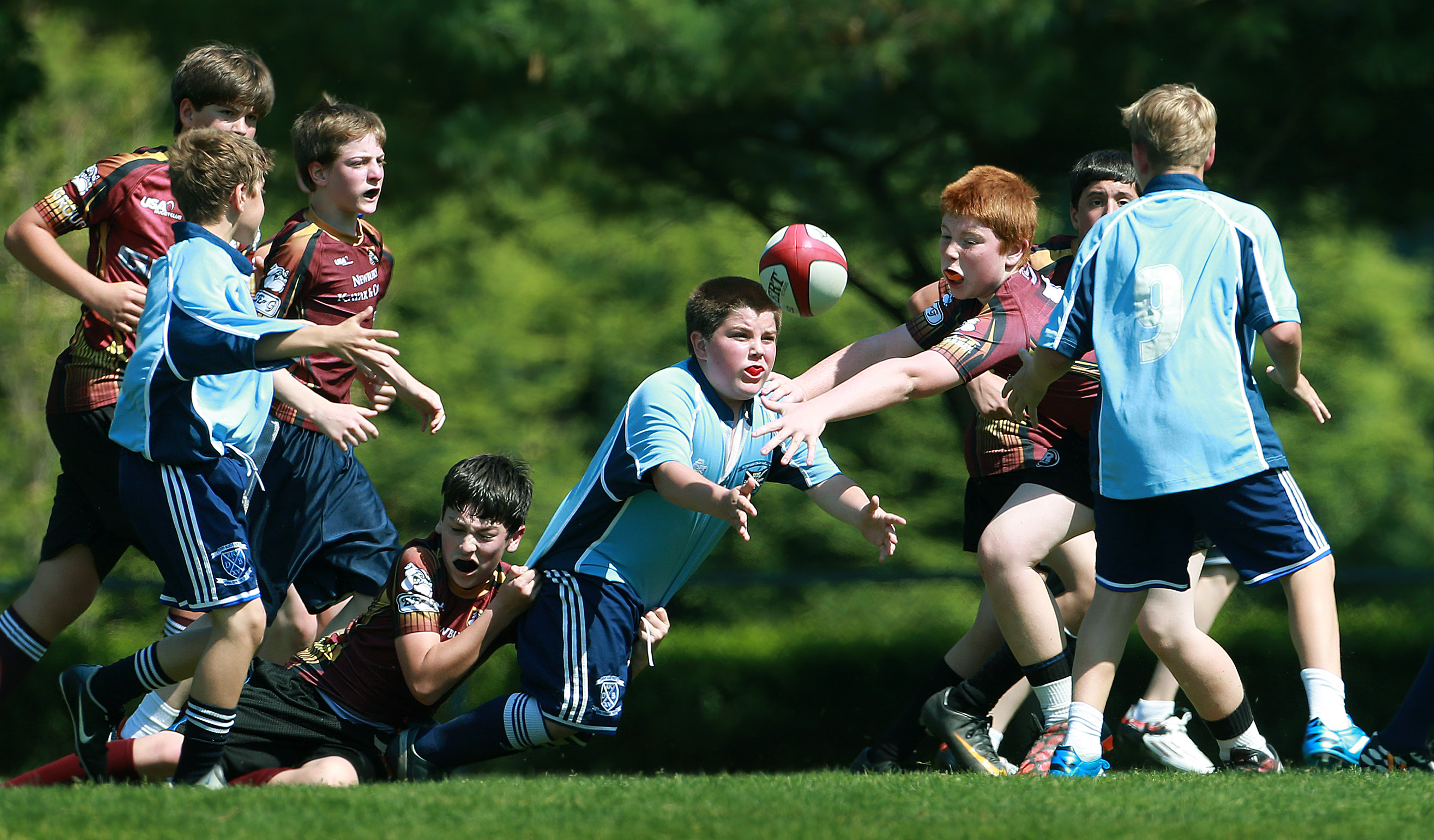 The Essex County Bulldogs U12 team (in maroon) playing a team from Derby Academy (in blue) in a recent game played in Hingham.