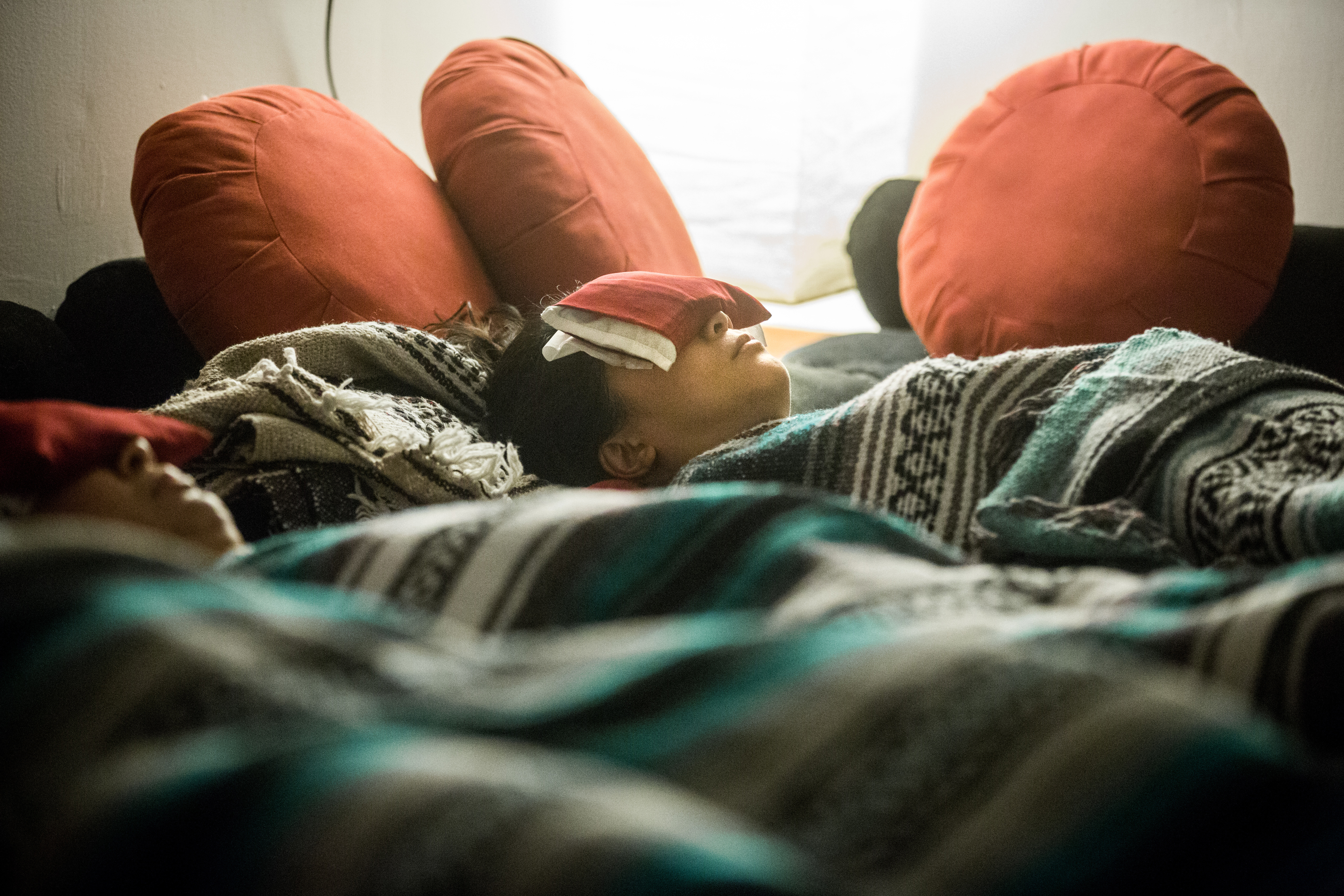 Thao Turcotte-Shamski (left) and Tram Anh Tran at a yoga nidra class at the Breathing Room in Cambridge