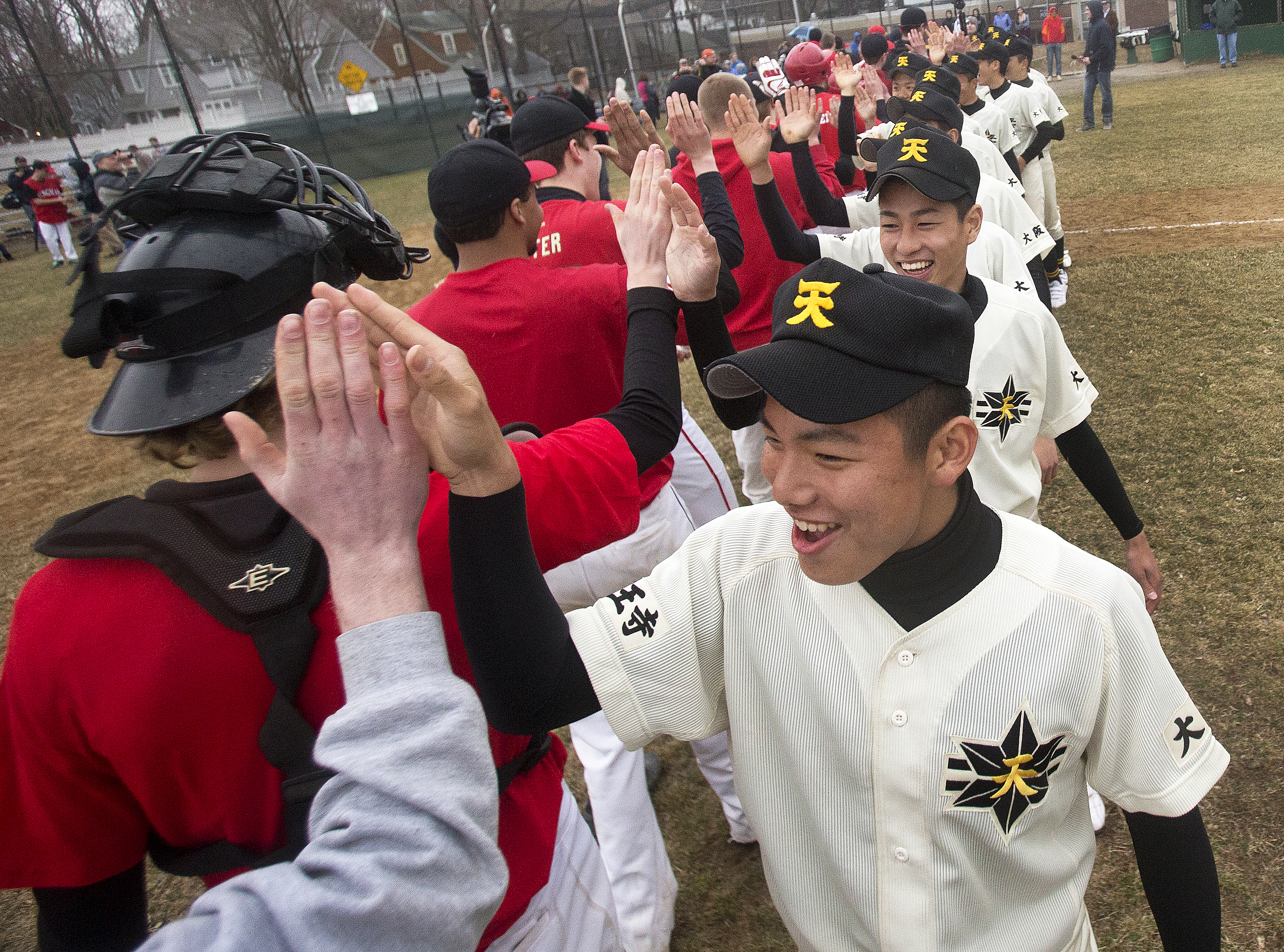 Riku Yokote led Tennoji players as they high-fived their Hingham counterparts after the scrimmage.
