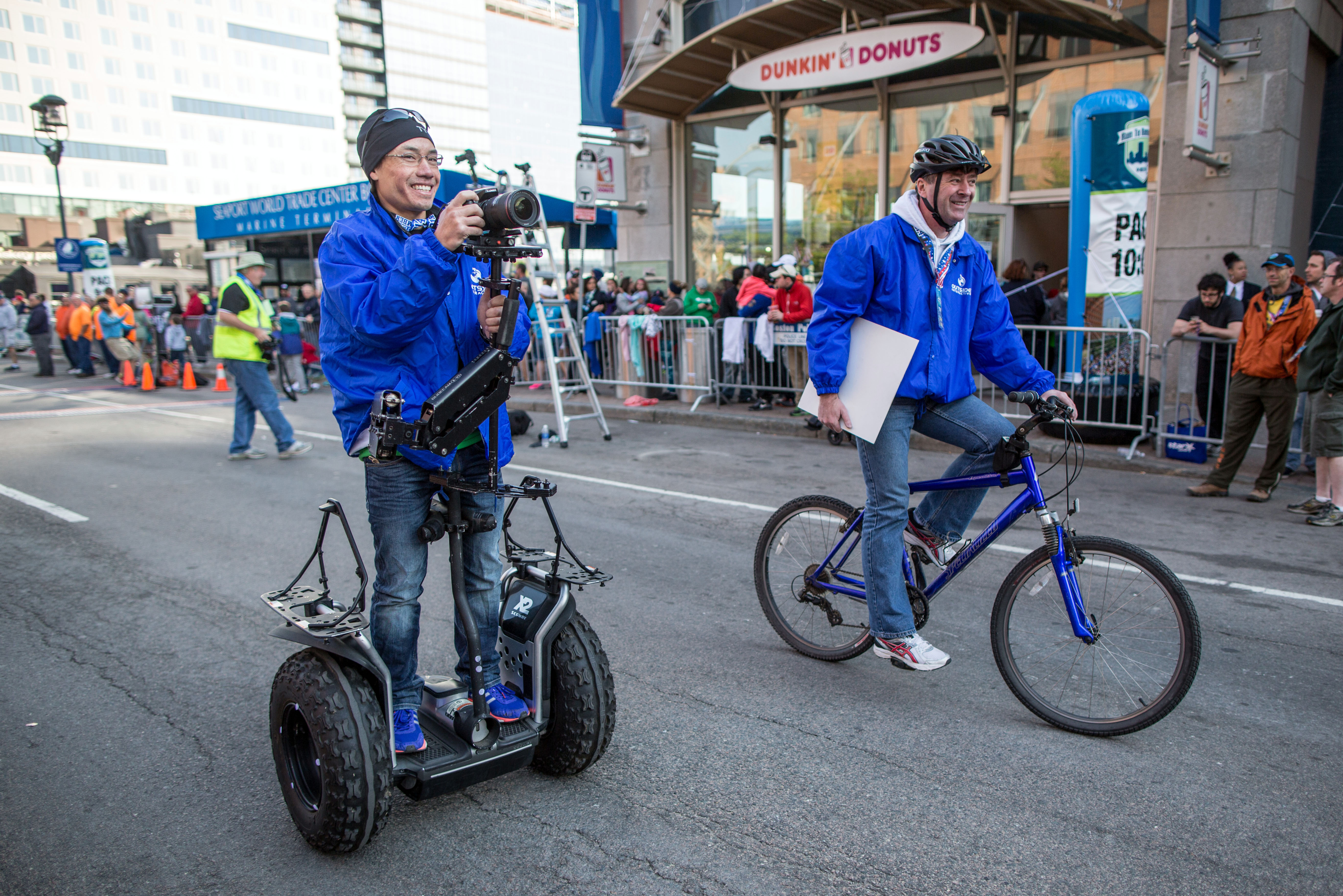 Jason Bui rides a Segway while making a video for the Virtual Runner app that allows runners to race on courses (such as Falmouth, below) using a treadmill and video screen.