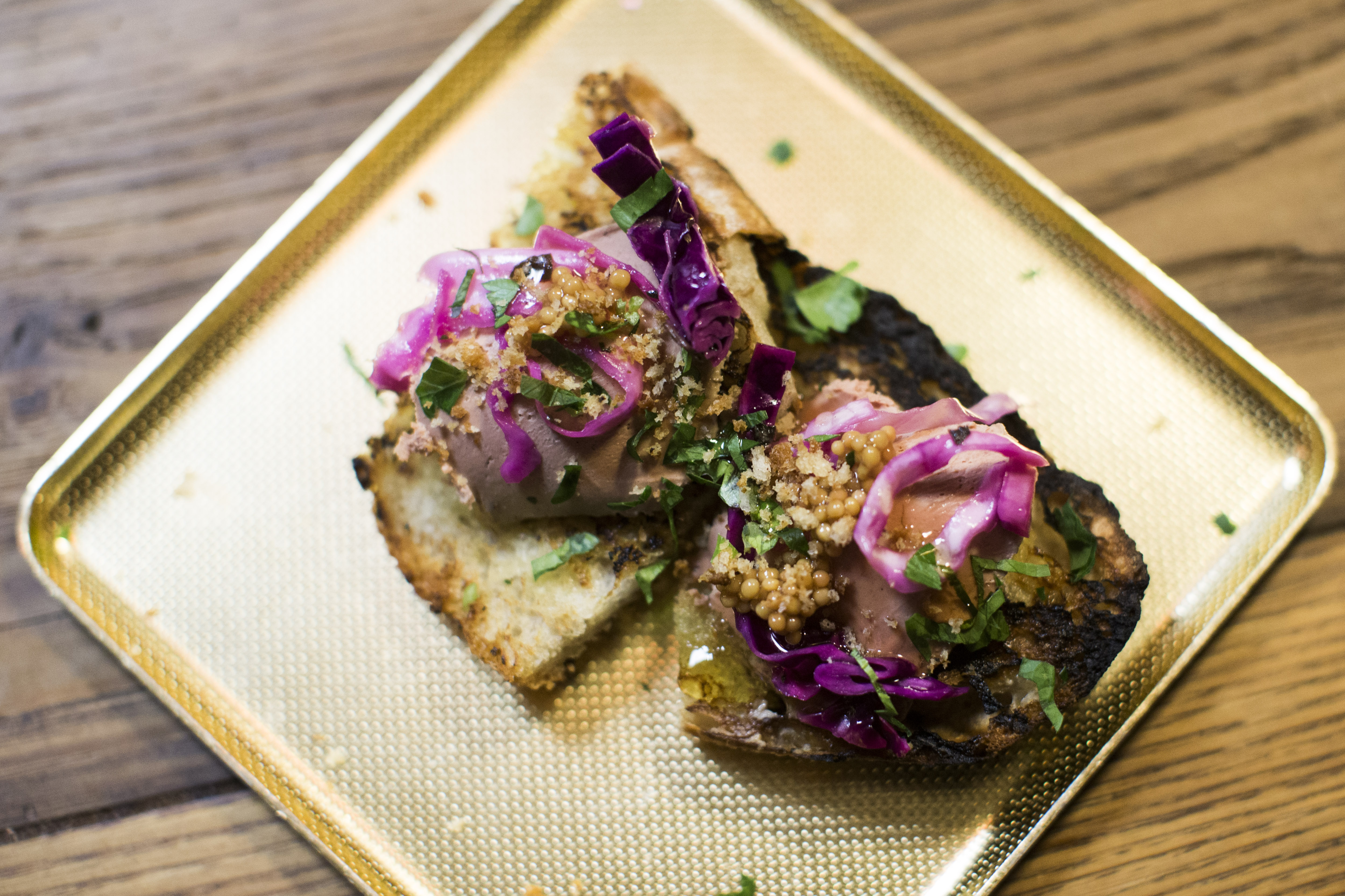 A plate of toasts with liver mousse at Brassica Kitchen & Cafe.