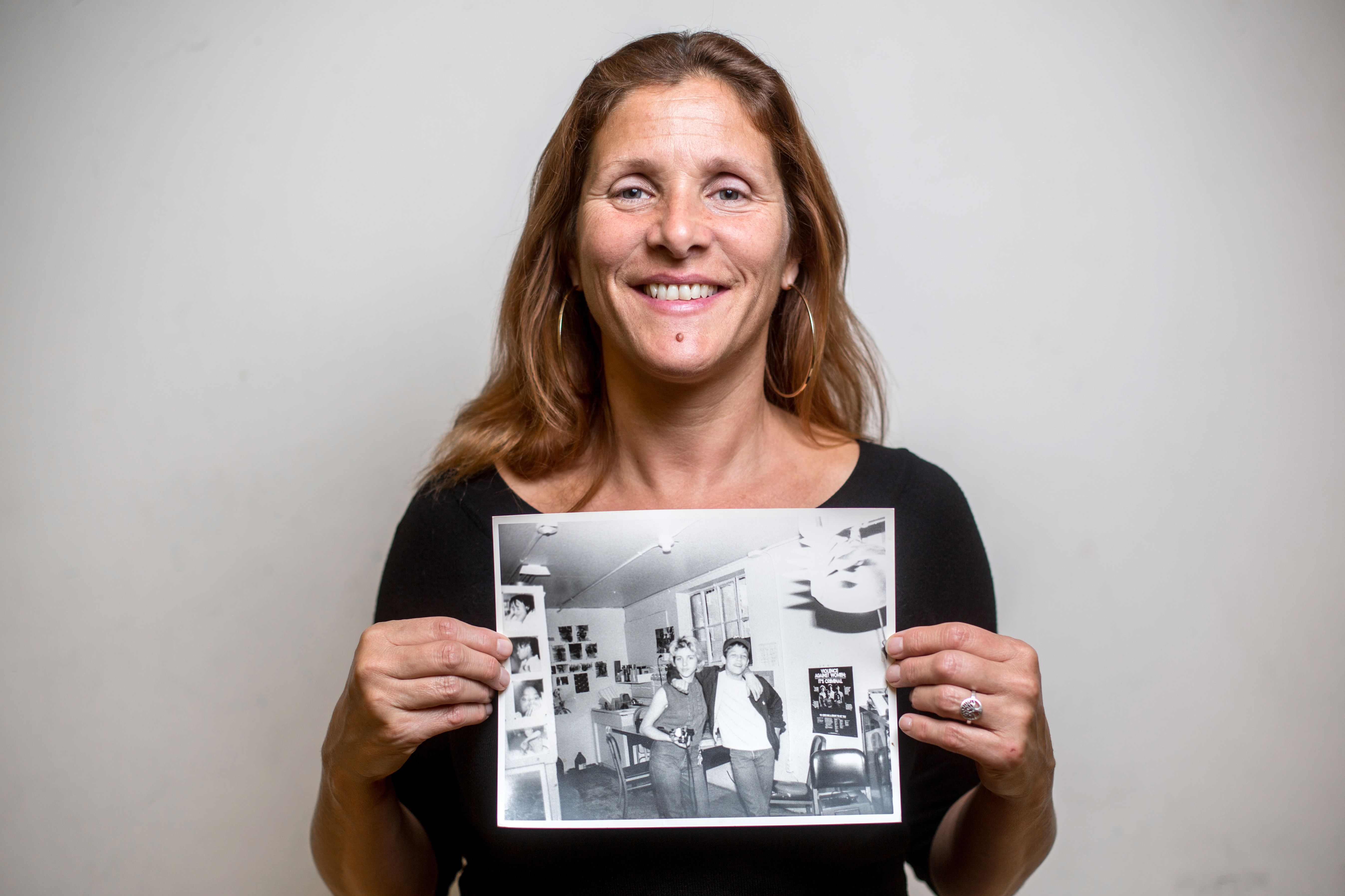Former Art Center photography teacher Susan Richards with a photo of herself and friend Derek Upshaw.